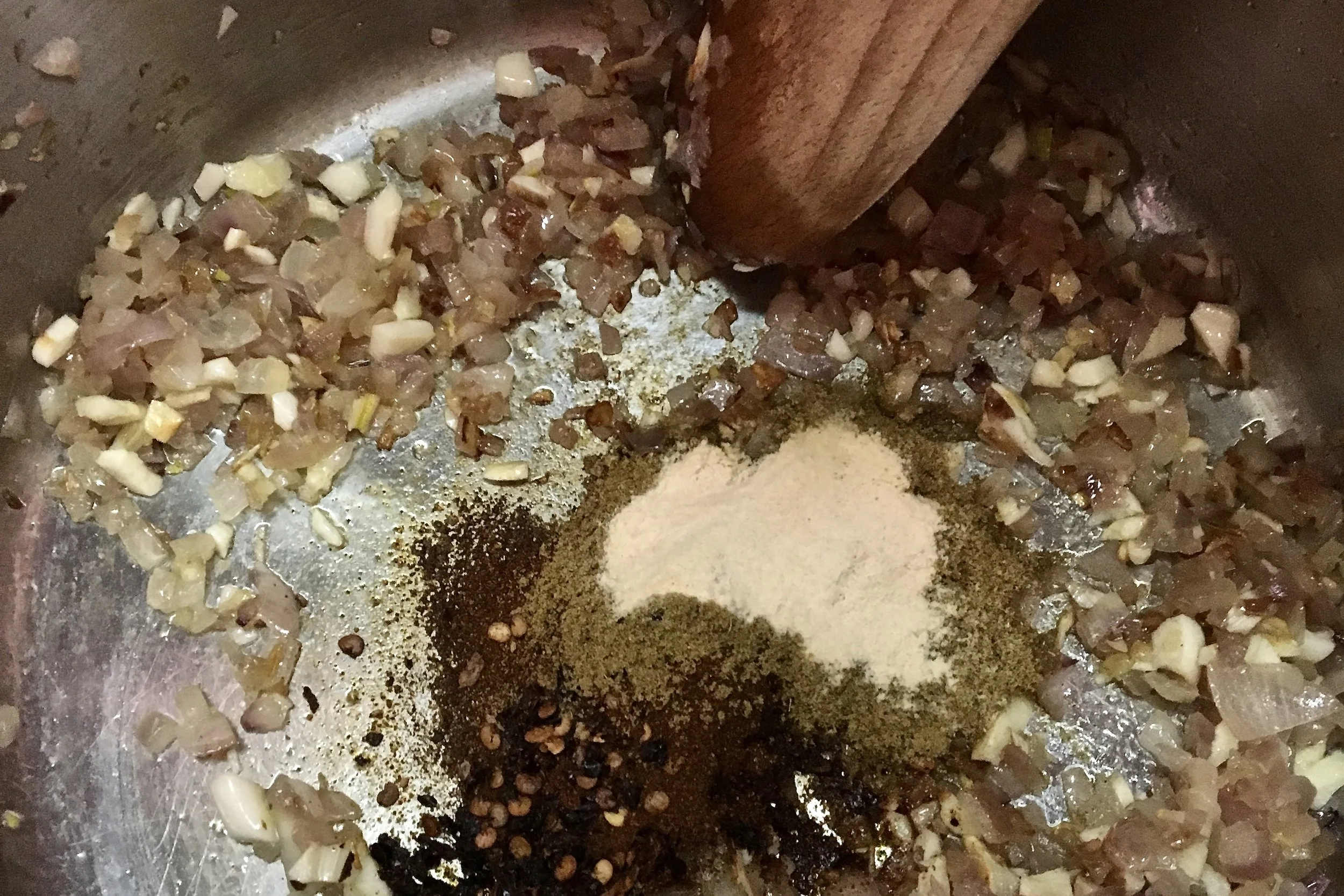 "Bloom" or sauté spices in oil first to awaken their flavor compounds and infuse flavor throughout the chili through the cooking oil.
