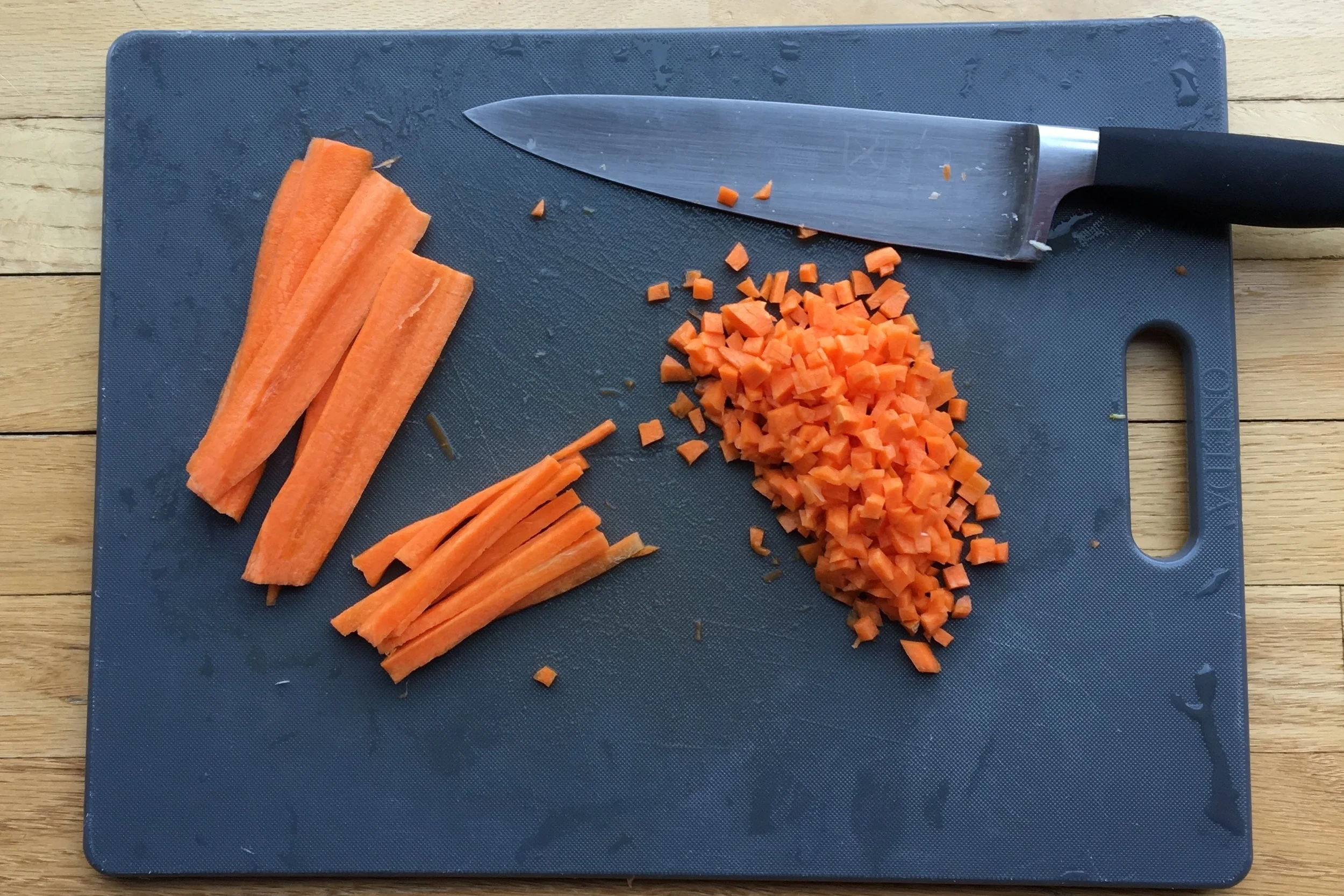 To cut vegetables into a small dice, first cut 1/4 inch thick planks, then strips, then cubes. (see steps from left to right above)