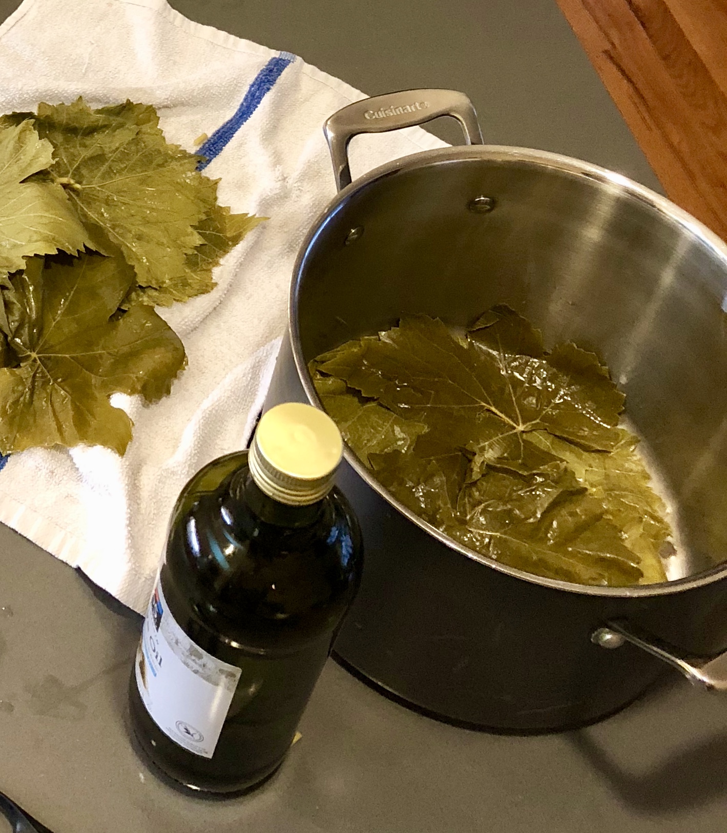 Line the bottom of the stock pot with grape leaves to prevent your dolmas from burning or browning. Use the broken or torn leaves.