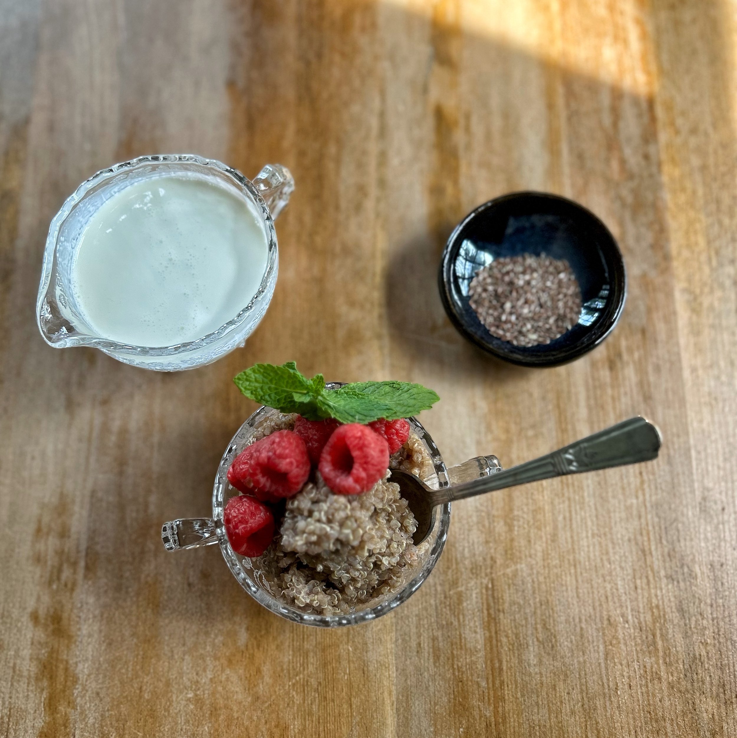 quinoa porridge cream and raspberries.jpeg