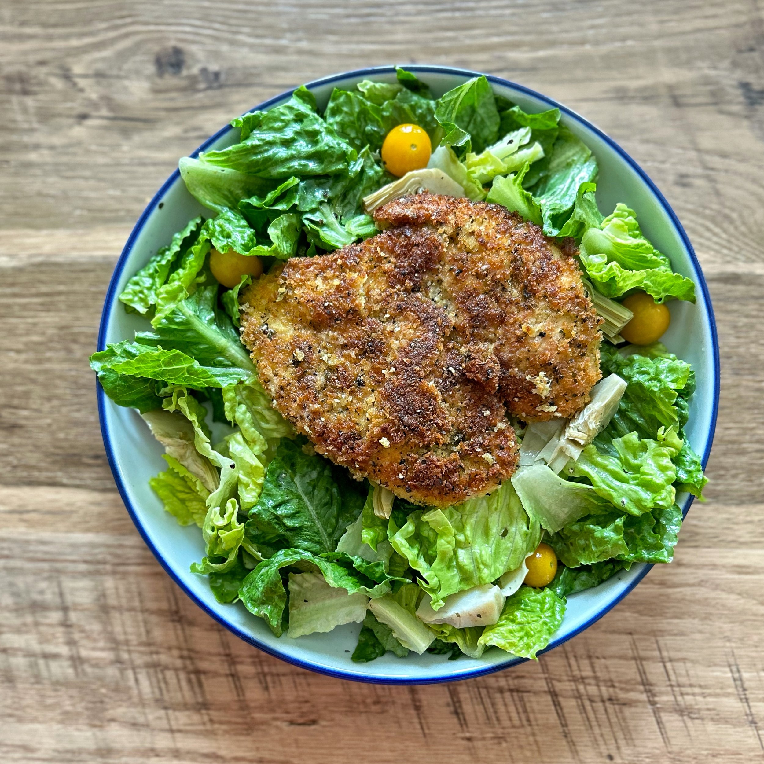 chicken milanese on a salad.jpg