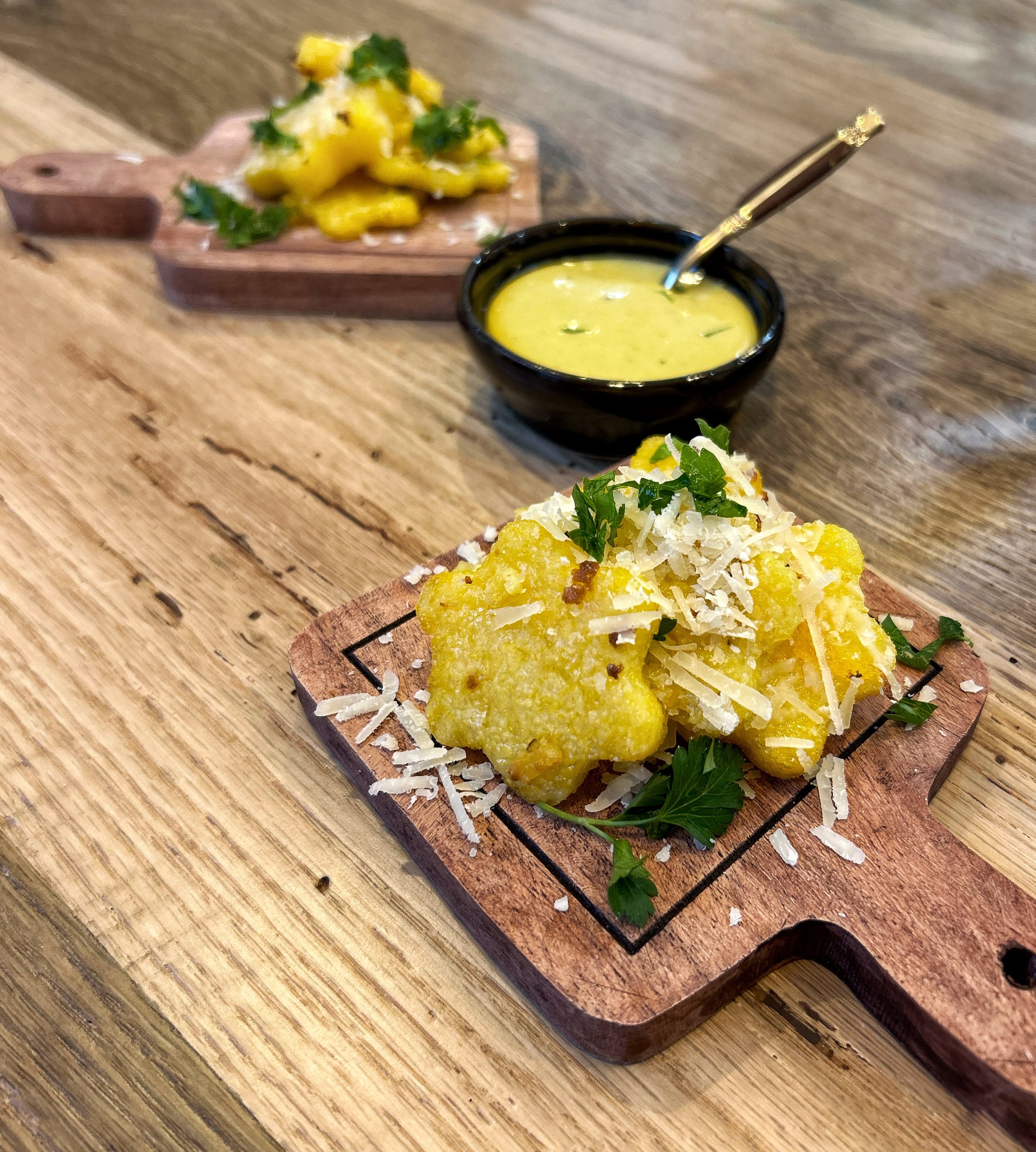 flower shaped polenta fries on wood board.jpeg