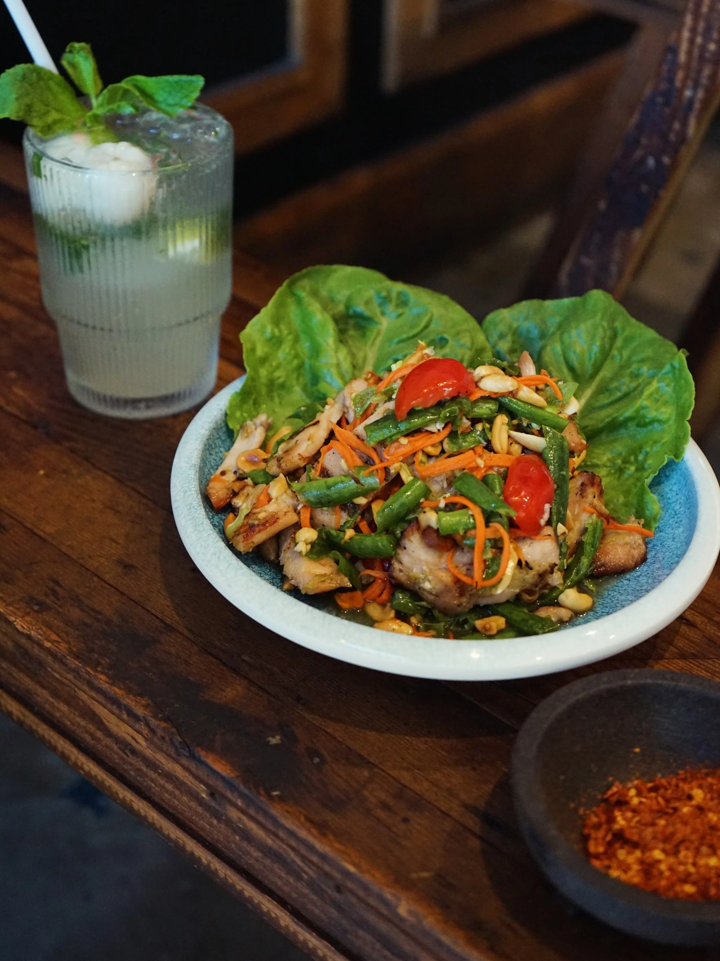 Gai Tok Krok is here 🔥 Grilled chicken, 
pounded by hand in the mortar with our som tum sauce 
&mdash; smoky, tangy, a little fire. 

New on the menu, one bite and you&rsquo;ll get it.

#gaitokkrok #birdandbuffalo #eatlocal #chickensalad #thaifoodlo