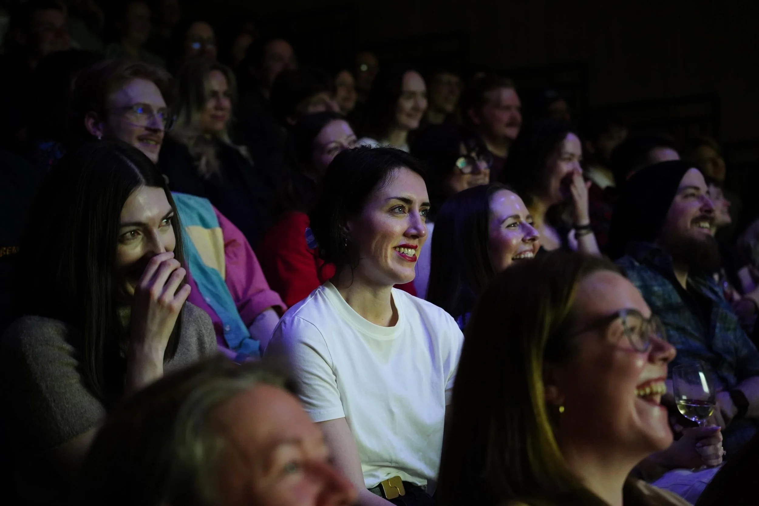 Audience members at the Curio event laughing