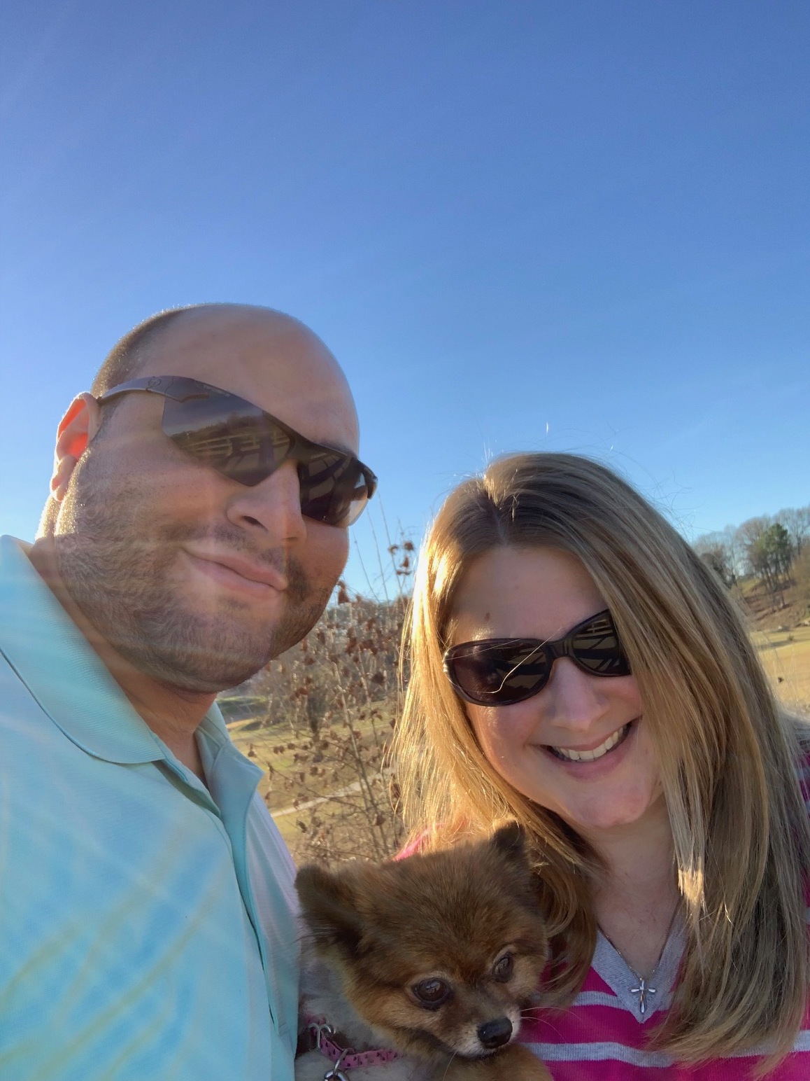 My husband and I with our Pomeranian, Daisy.