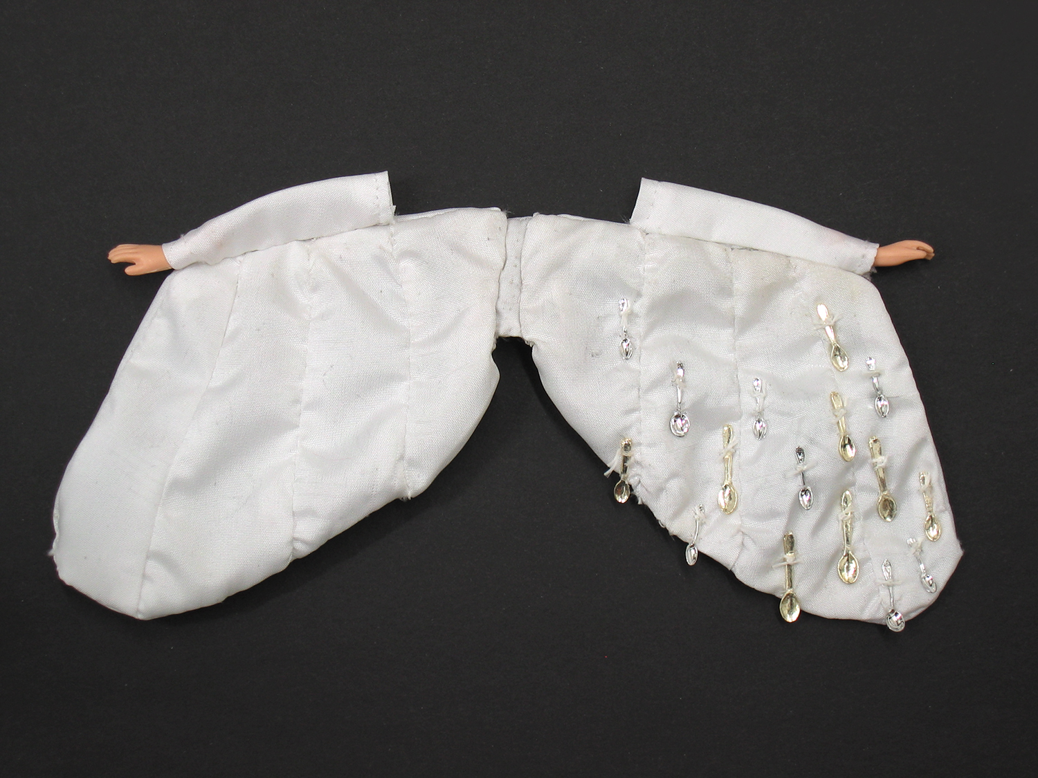   Sophia's Wings  (maquette), 2006, fabric, thread, doll hands, dollhouse spoons, 3.5 x 8 in. 