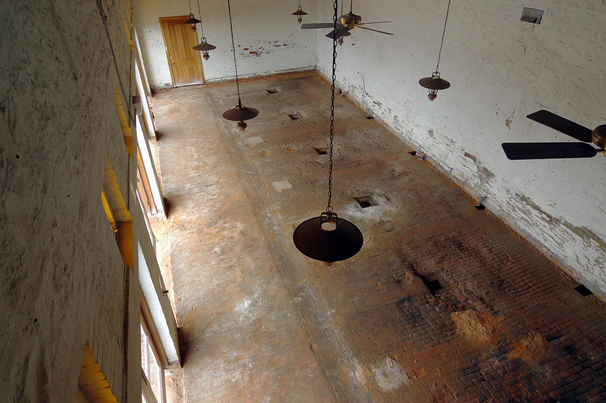 The old brick-paved stable floor as it was found during renovations.