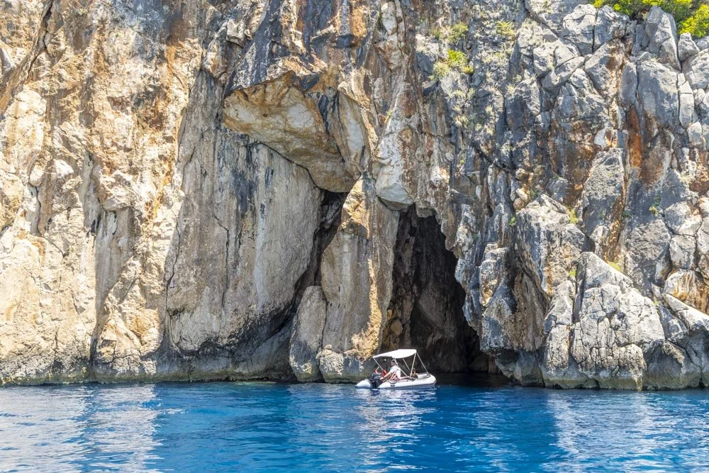 Hiring a boat in Himare: escaping the crowds to reach incredible sea caves &amp; stunning beaches