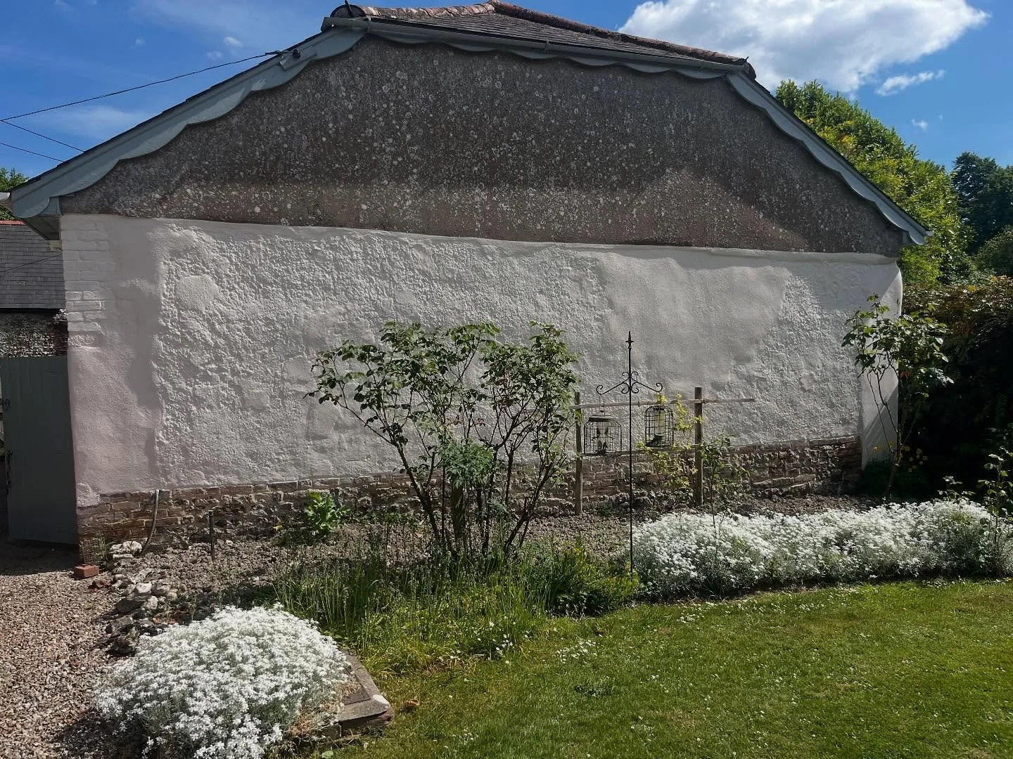 Dorset&rsquo;s many building materials looking nice in the sunshine ☀️ Chalk cob wall with great patina never been rendered as a sheltered elevation - we consolidated small areas with lime mortar patch repairs and an off white limewash to finish.  #l