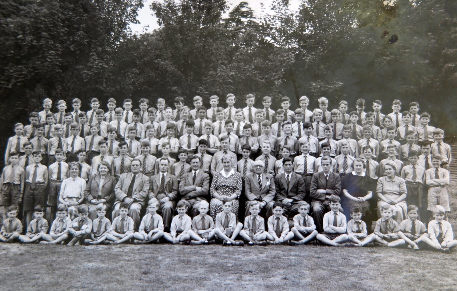This undated school picture from the 1950s shows Molly Sinclair (centre in spotted dress) with Headmaster Mr George Rutherford to her right