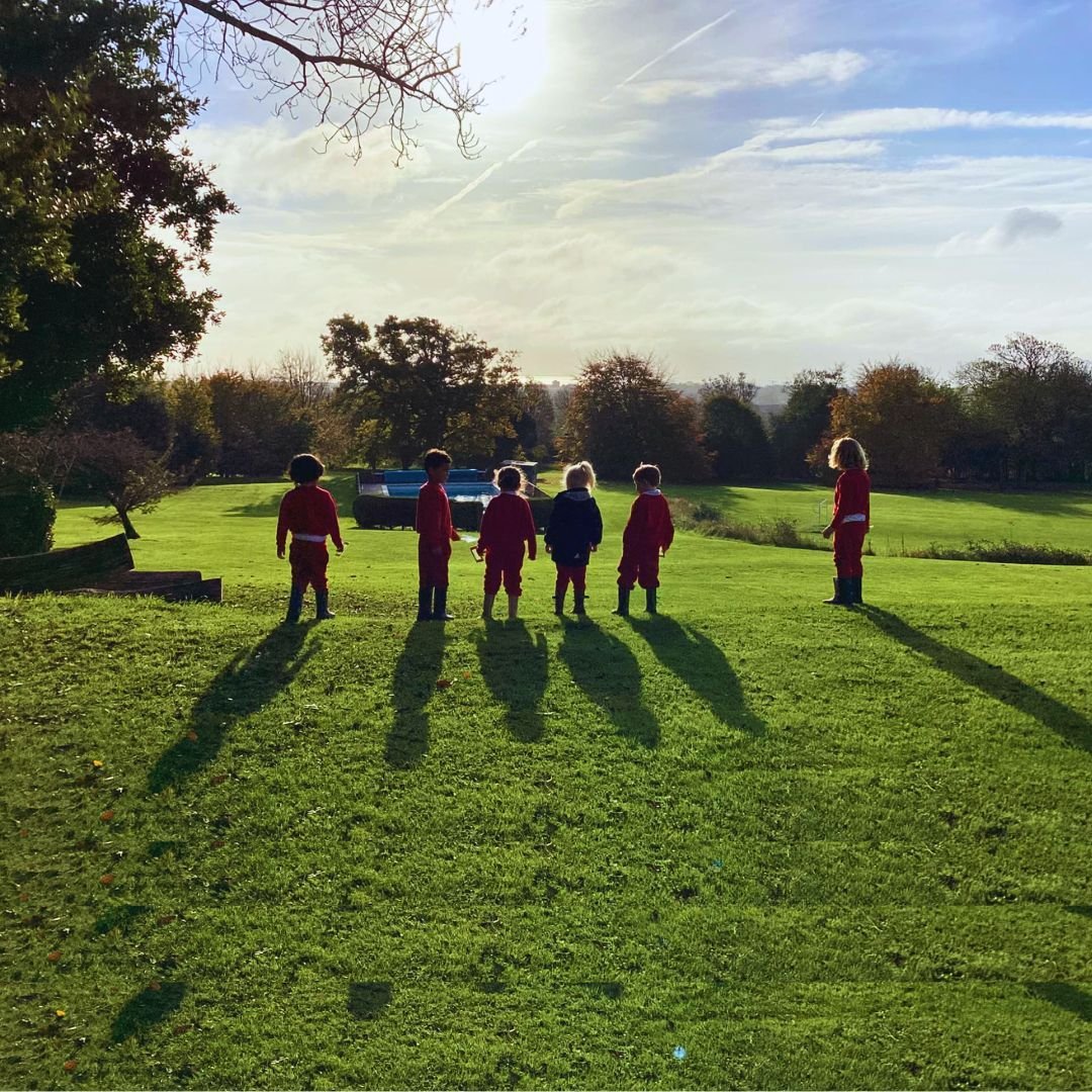 🌞 &quot;In the morning light, shadows stretch, as dreams meet dawn...&quot; 🌞

A beautiful moment captured of our Early Years children, bathed in sunlight and casting long shadows across the grounds of Sompting Abbotts. They're gazing south towards