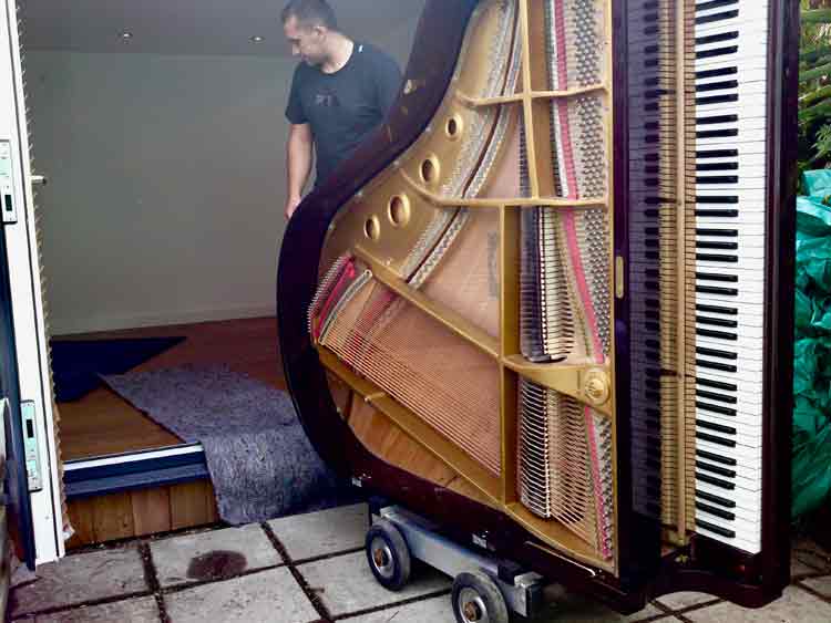 Piano arriving in the then new studio