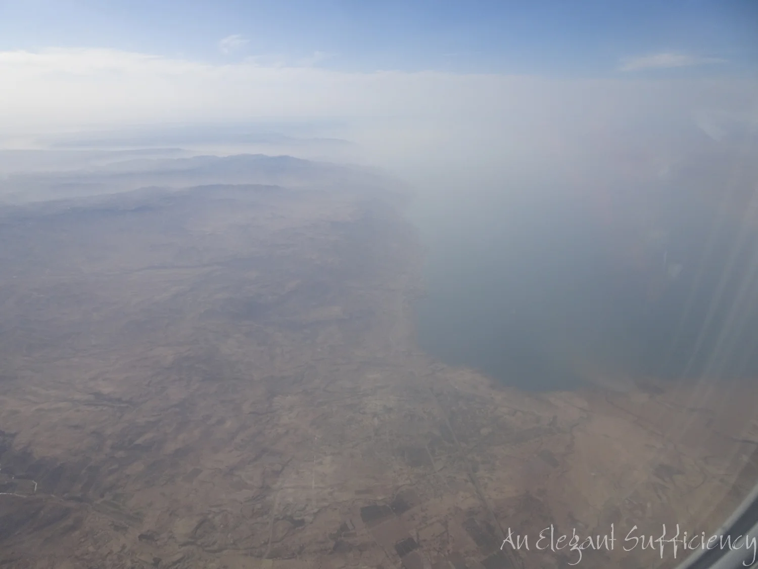 We had started the day somewhere along the Eastern side of the coastline around the centre of the picture and the muddy patch in the water almost beneath us is where the River Jordan enters the Dead Sea. (We are flying westwards)