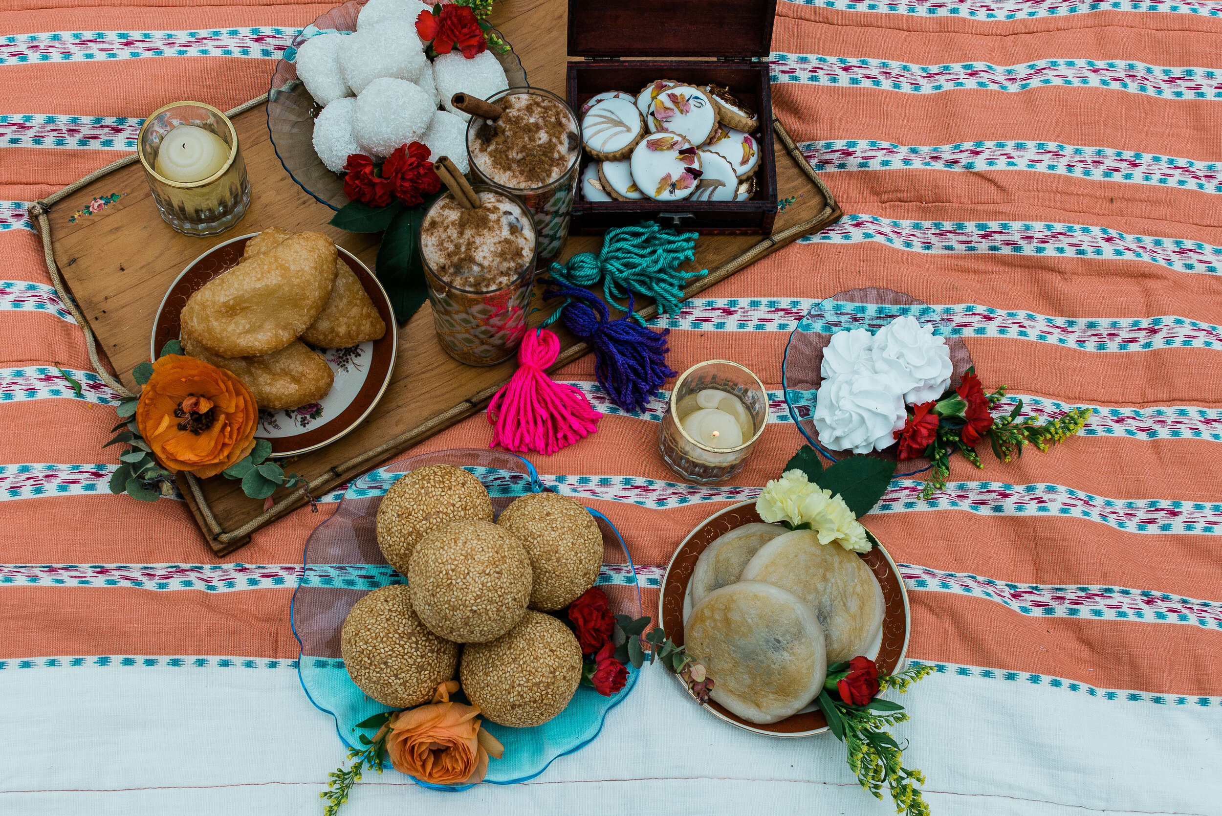 wedding picnic fare from Dominican and Chinese cultures laid out on blanket  (Copy)