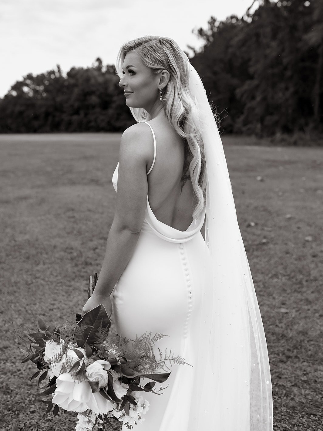 Cheers to Mr. &amp; Mrs. Ussery!!! Our beautiful MEB bride @kaylee.ussery looks absolutely stunning in her @madewithlovebridal wedding gown✨ Wishing you both a lifetime of love🤍 

#margaretellenbridal 
Bride: @kaylee.ussery 
Photographer: @photograp