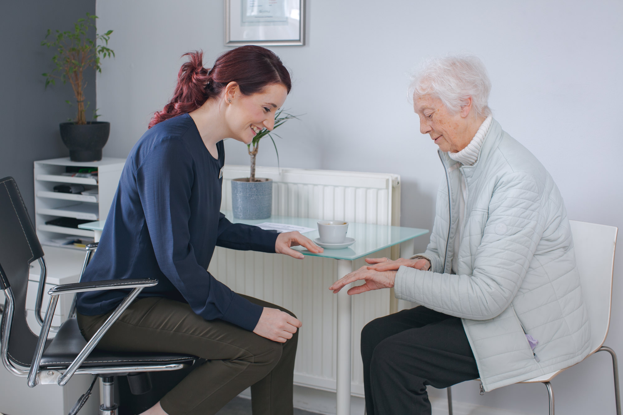 osteopath and old lady talking through pains (Copy)