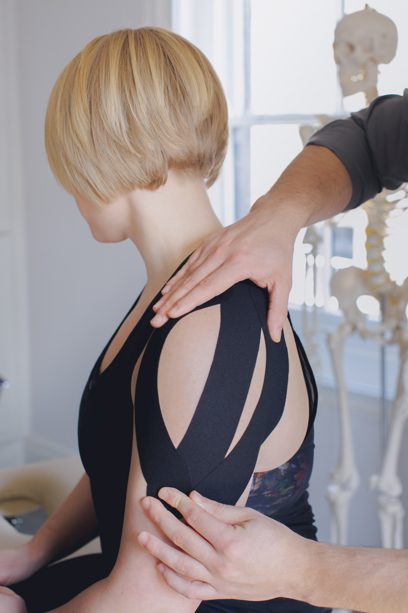 female with sports injury having shoulder massage (Copy)