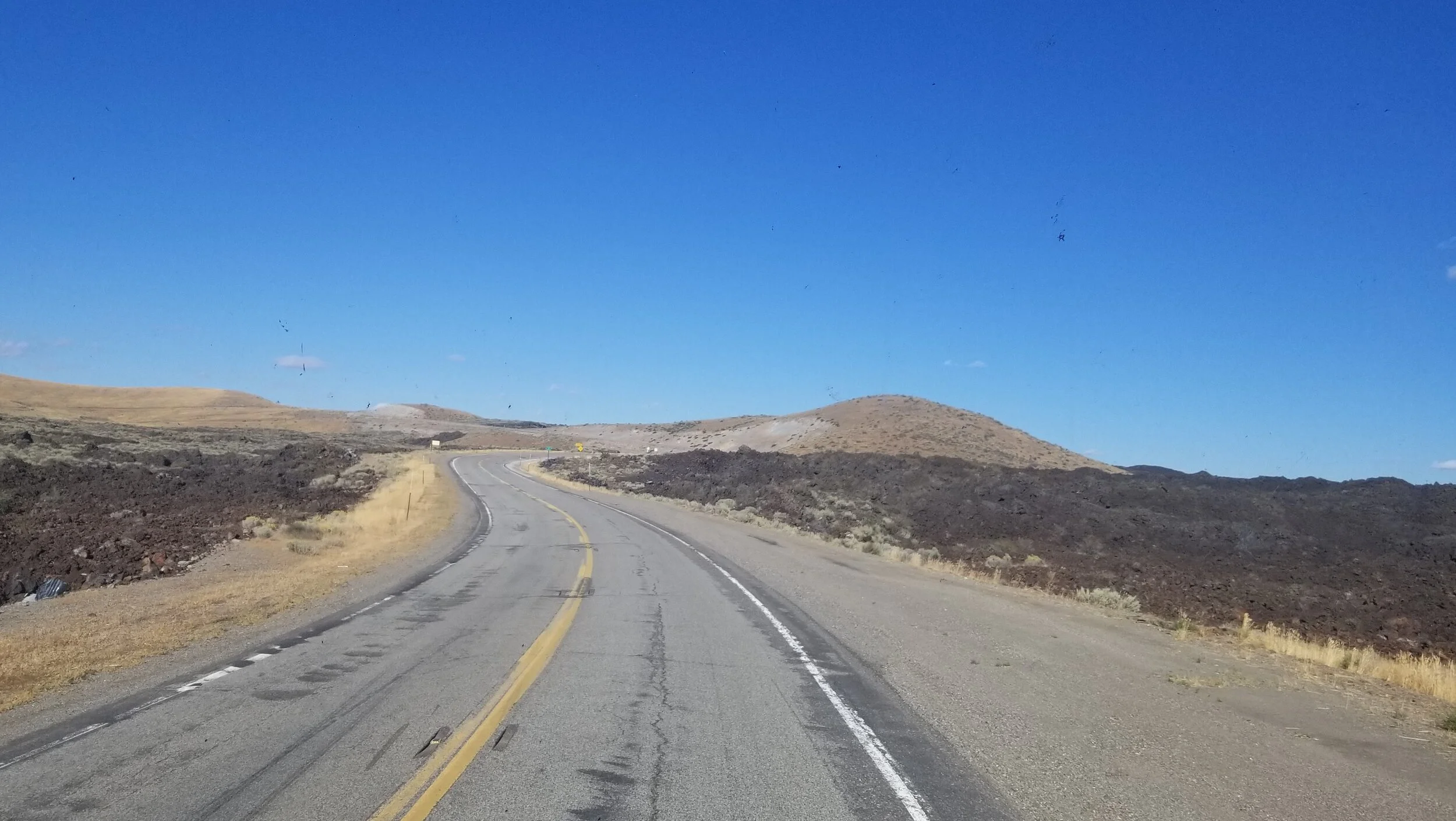 On our way to Arco, passing by Craters of the Moon. The lava rock came up to the highway!
