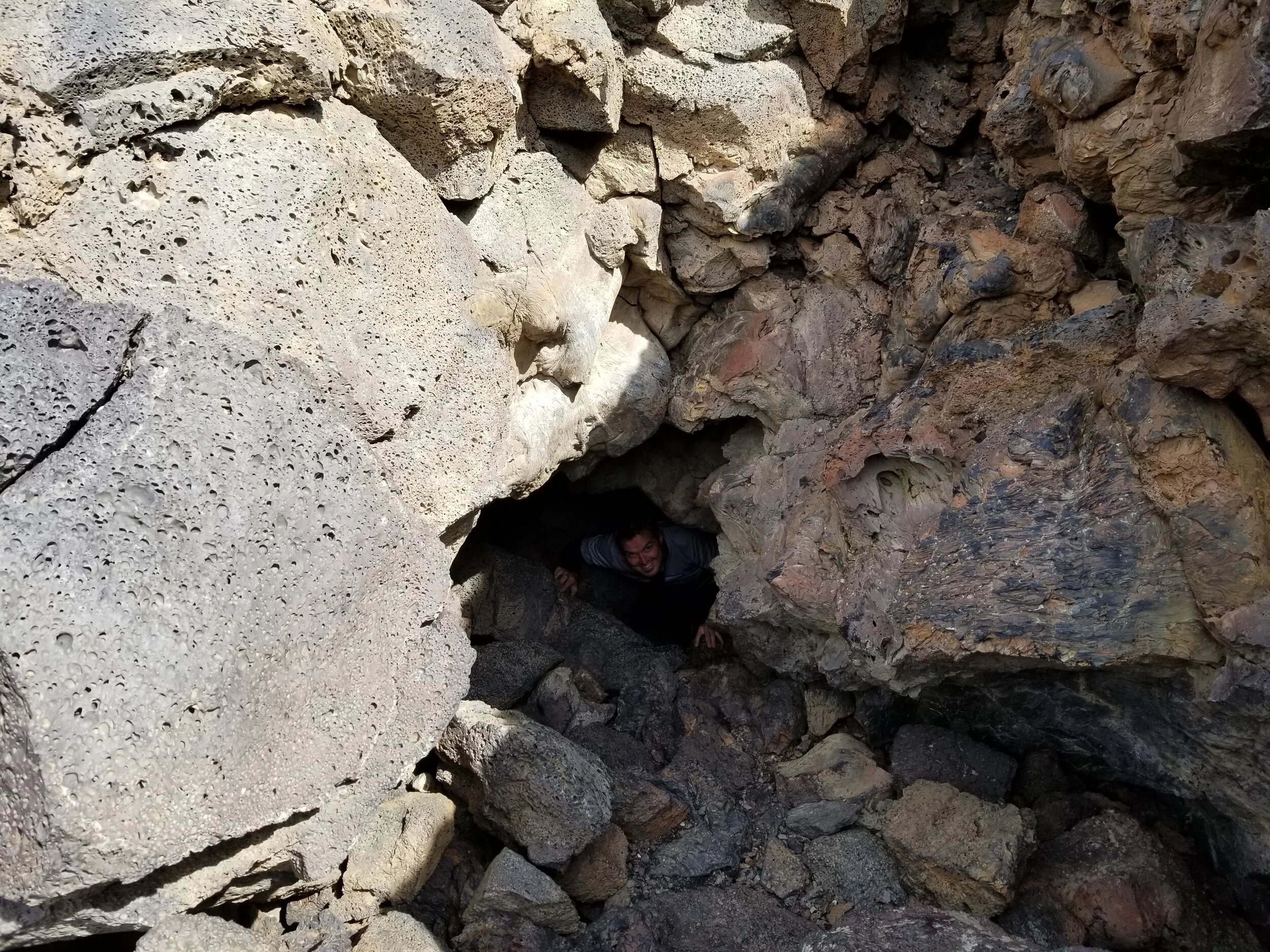 Climbing out of the second entrance in the Boy Scout Cave