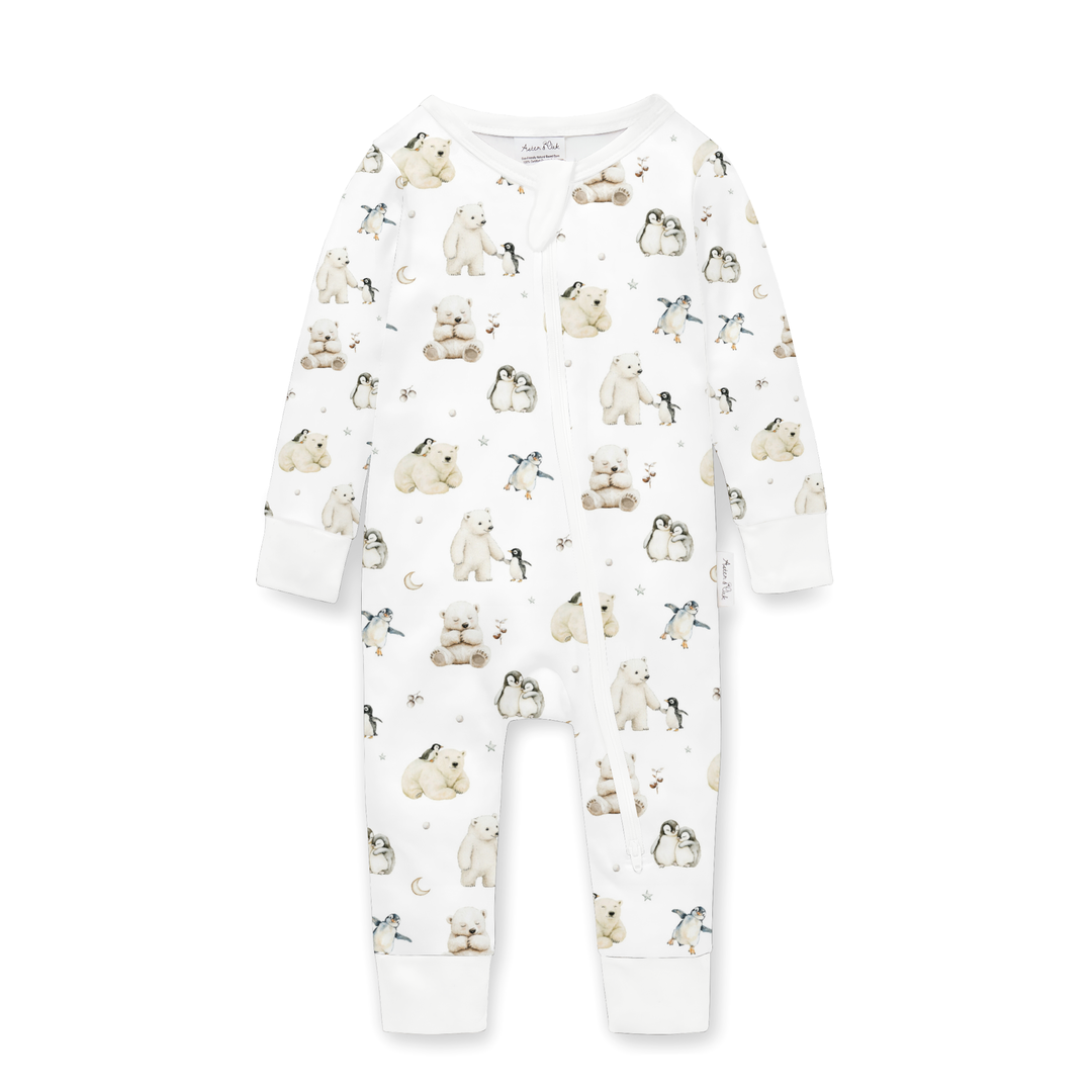 White children's pajamas with a polar bear and penguin print.