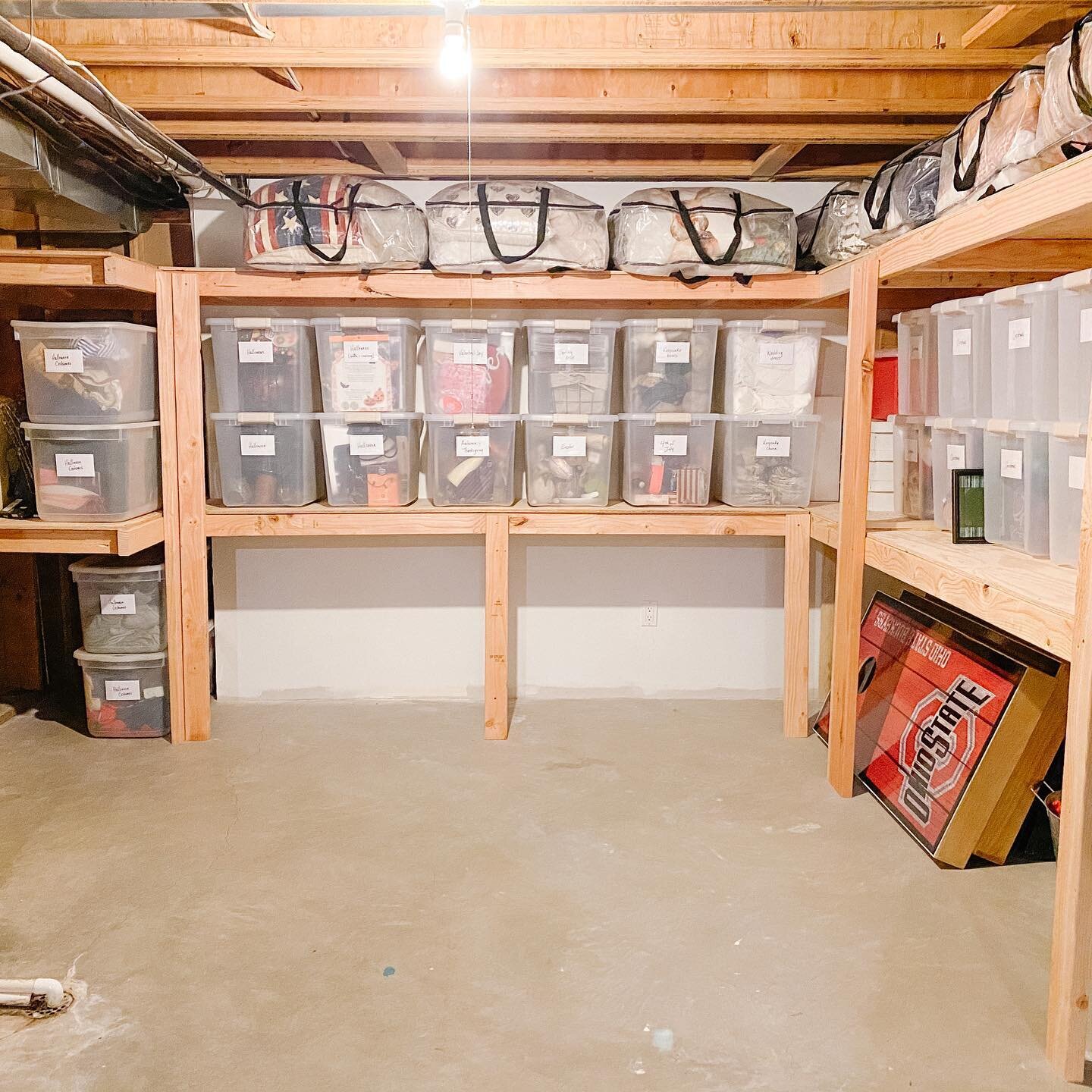 STORAGE ROOM.  This storage room was pulled together pretty quickly (after days of sorting &amp; editing out the excess!) thanks to this client&rsquo;s handy husband who built all these wood storage shelves.
⠀⠀⠀⠀⠀⠀⠀⠀⠀
The clear bins not only allow yo