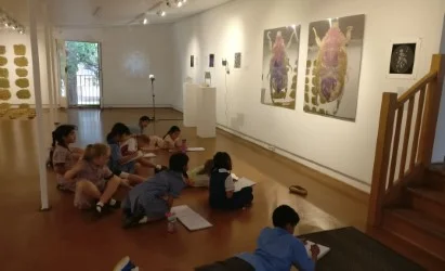 Visitors to the Imag(in)ing exhibition at Ewart Gallery, 2018 viewing the Christmas Beetles.
