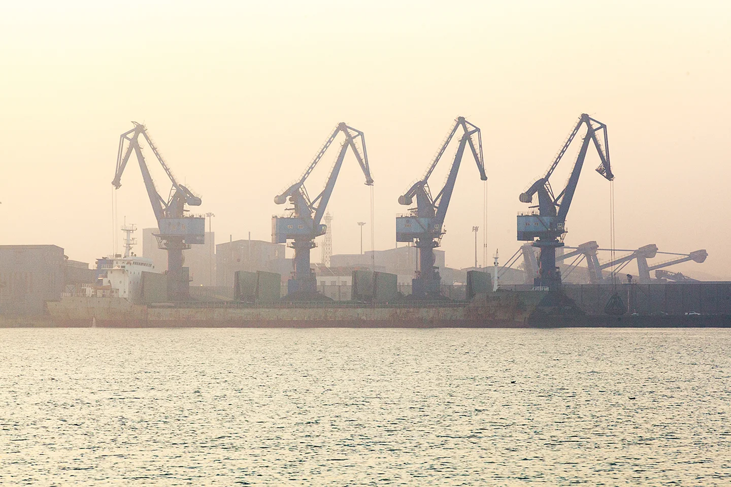 Jasper James Studio Industrial Photographer Four loading cranes in port