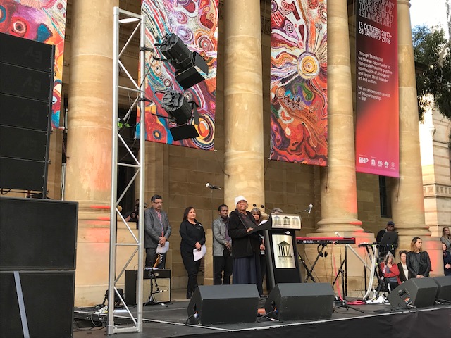 Ku Arts Anangu Mayatja, Alison Milyika Carroll, gives an opening address in Pitjantjatjara language at the opening of TARNANTHI Festival of Contemporary Aboriginal and Torres Strait Islander Art, Art Gallery of South Australia, 2017. Photo: Ku Arts