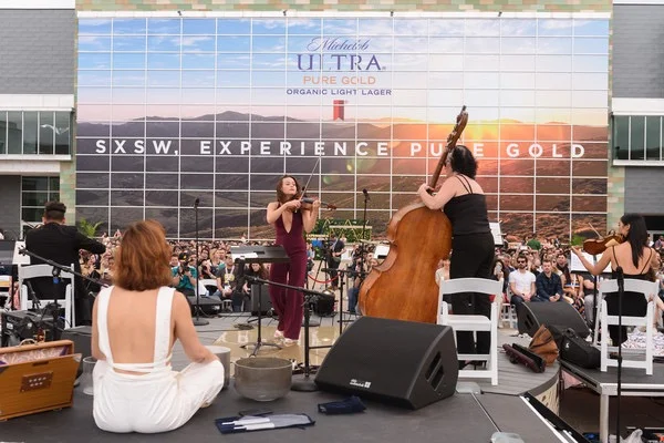 Beer brand Michelob hosted SXSW’s first mass sunset meditation this year, complete with live music ( Source )