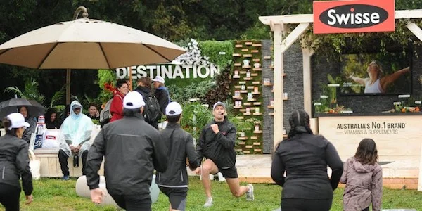 At SXSW 2019, vitamin and supplements brand Swisse hosted outdoor fitness classes that were conveniently located next to their booth. Image from Swisse .
