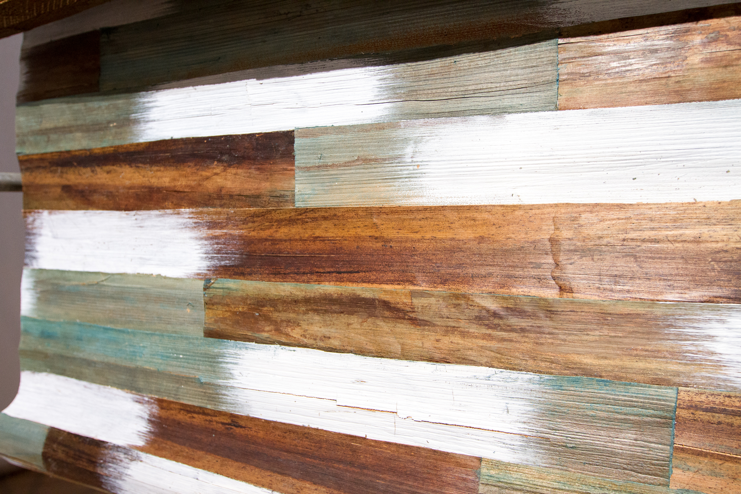  "Wallpaper" made from thin pieces of recovered wood. 