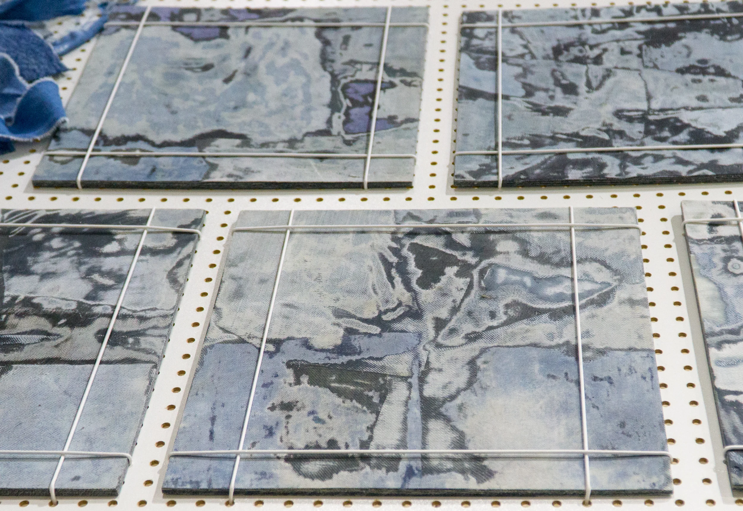 Bahia Denim by Sophie Rowley Waste material: Post-industrial denim waste Bahia Denim is created using production waste from the fashion industry. These textile offcuts are layered, adhered and carved to create intricate patterns. The non-standardized nature of the waste - the variation in size, shade, color and texture make the designs unique. In developing the material by hand endless color combinations can be explored achieving customized and one of a kind designs. The lightweight yet durable properties of the material allow for diverse applications in furniture, wall paneling or interior surfaces. sophierowley.com