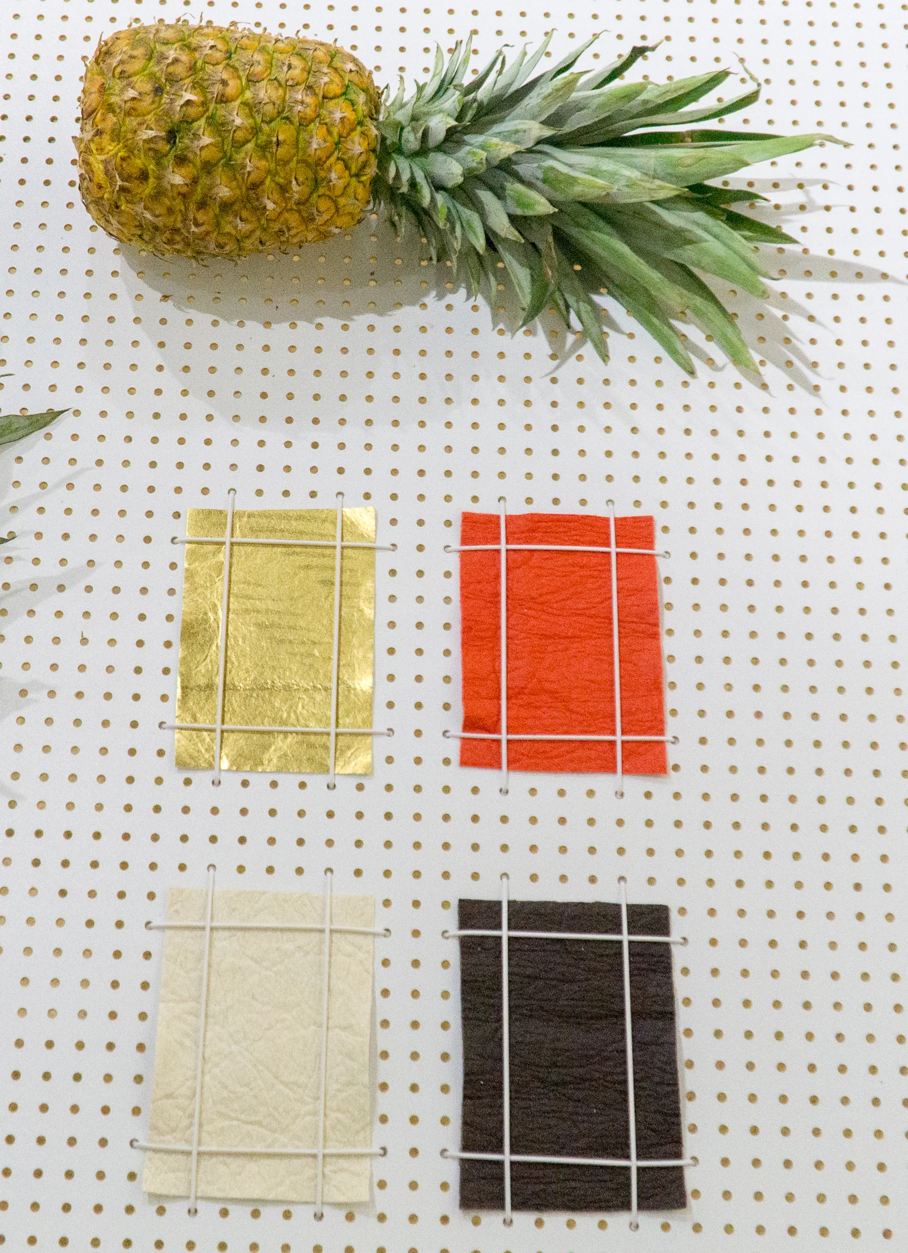 Pi ñatex Waste material: pineapple leaf fibre,agricultural by-product Piñatex® is a non-woven textile, developed for use as a low-impact alternative to leather and PVC/PU materials. This innovative textile is made from the leaves of the pineapple plant, the by-product of the fruit industry, which are traditionally discarded or burned. Adding value to this agricultural waste has created a new source of income for farming communities who otherwise rely on a seasonal harvest. Piñatex offers a leather-like appearance and properties, creating a textile that is soft and flexible, yet very durable. ananas-anam.com