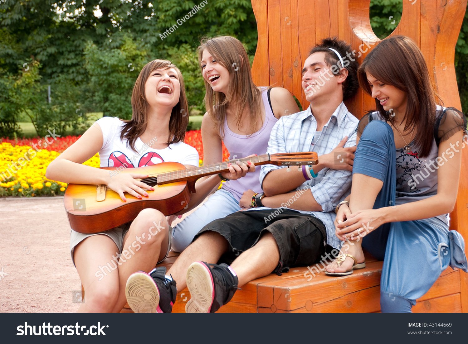 art hteatre music possiblestock-photo-four-young-friends-play-the-guitar-and-laughing-outdoors-43144669 (002).jpg