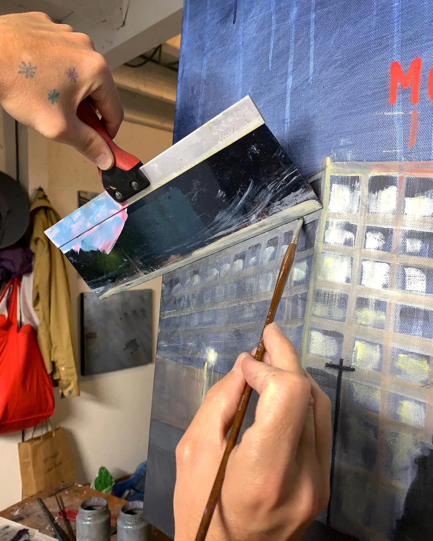 The use of tools and masking plays a big part in my painting process, especially when it comes to geometric shapes such as buildings. I also spend a significant amount of work time taking paint *off* the canvas, using rags or newsprint, to soften or 