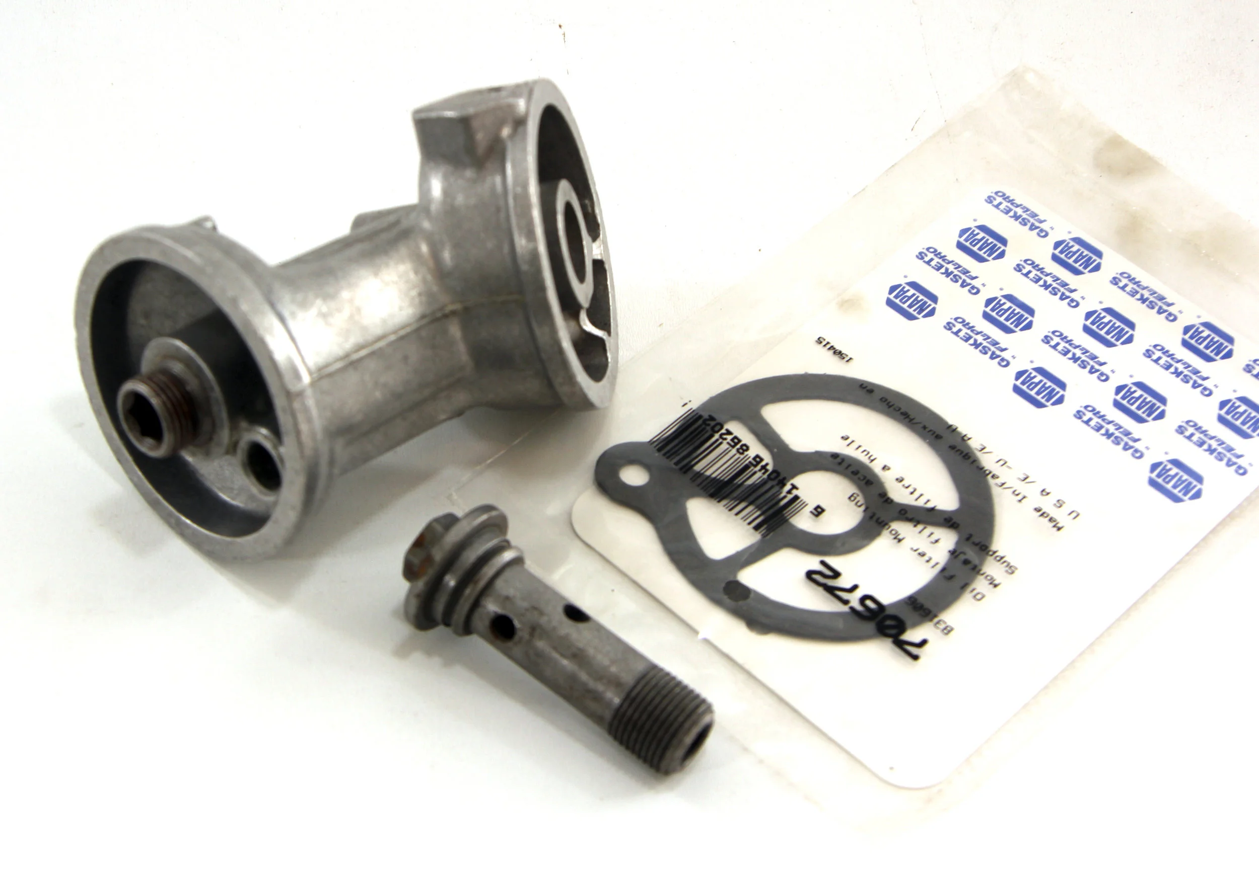 OIL FILTER ADAPTER C/W GASKET AND FITTING BOLT