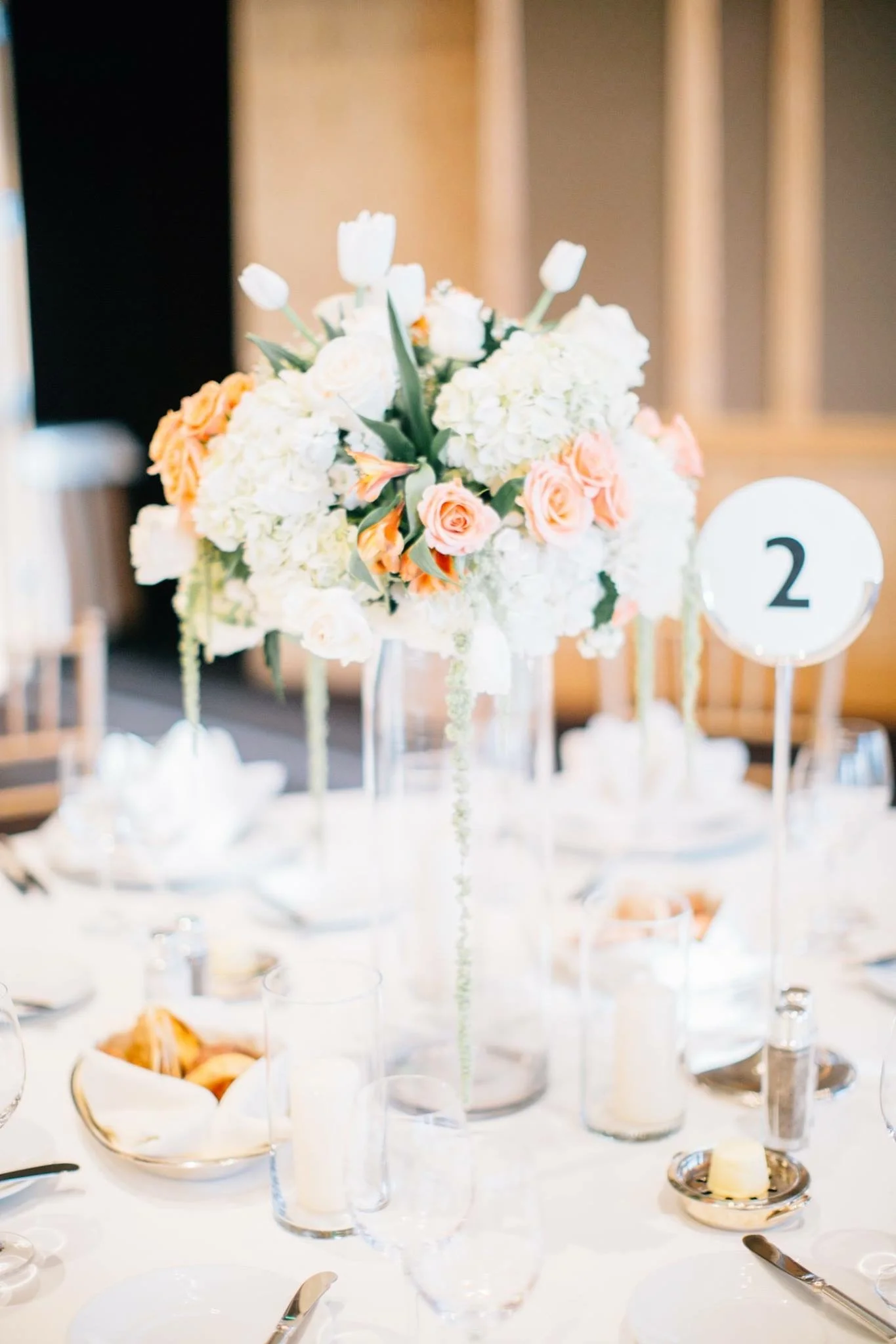 We made sure to position the taller of the centerpieces in such a way as to allow guests to see each other across the table for better conversation during dinner and dancing. The corsages were wristlets worn by the important women in the couple's family.
