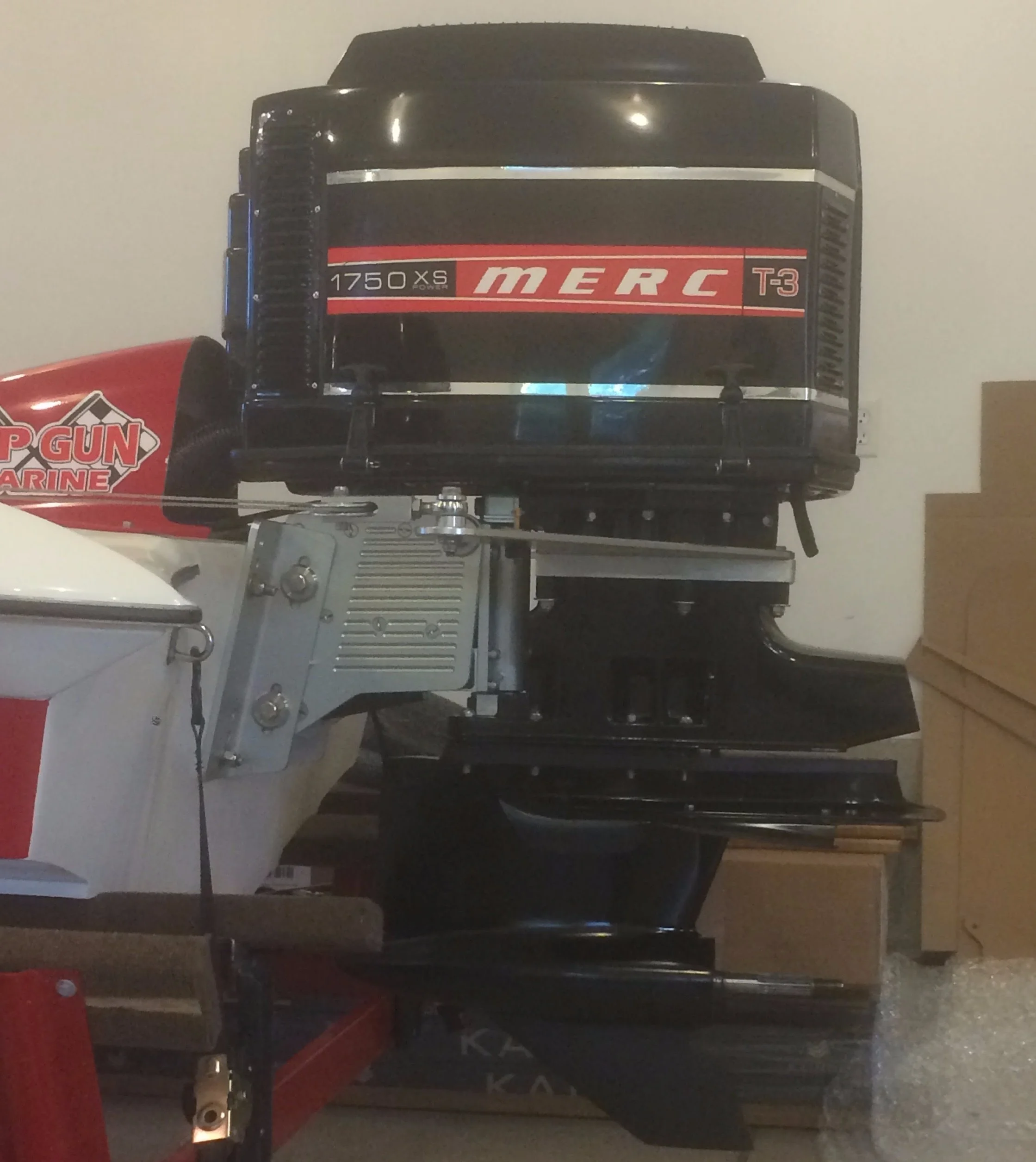 A customized Mercury Racing 2.5, Geiger Tec fabbed mid, retro cowling and wing plates.