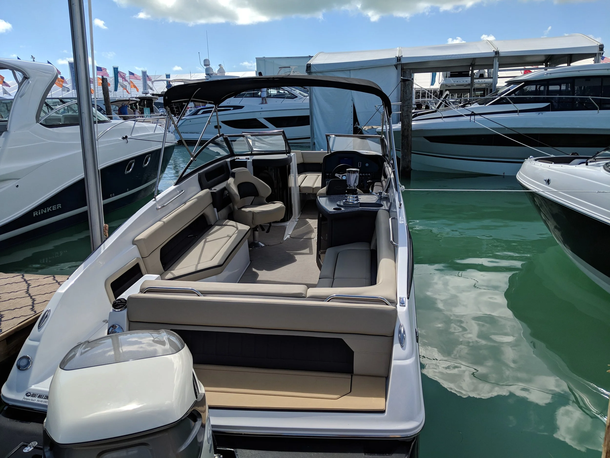 Rinker does a nice job here if your only goal is to suntan and make smoothies. You don't want to sit on the driver's side though, good chance that blender will crank you in the head and spill all over you. It looks like a rear bench seat on the swim platform too, I think, it's hard to tell. 