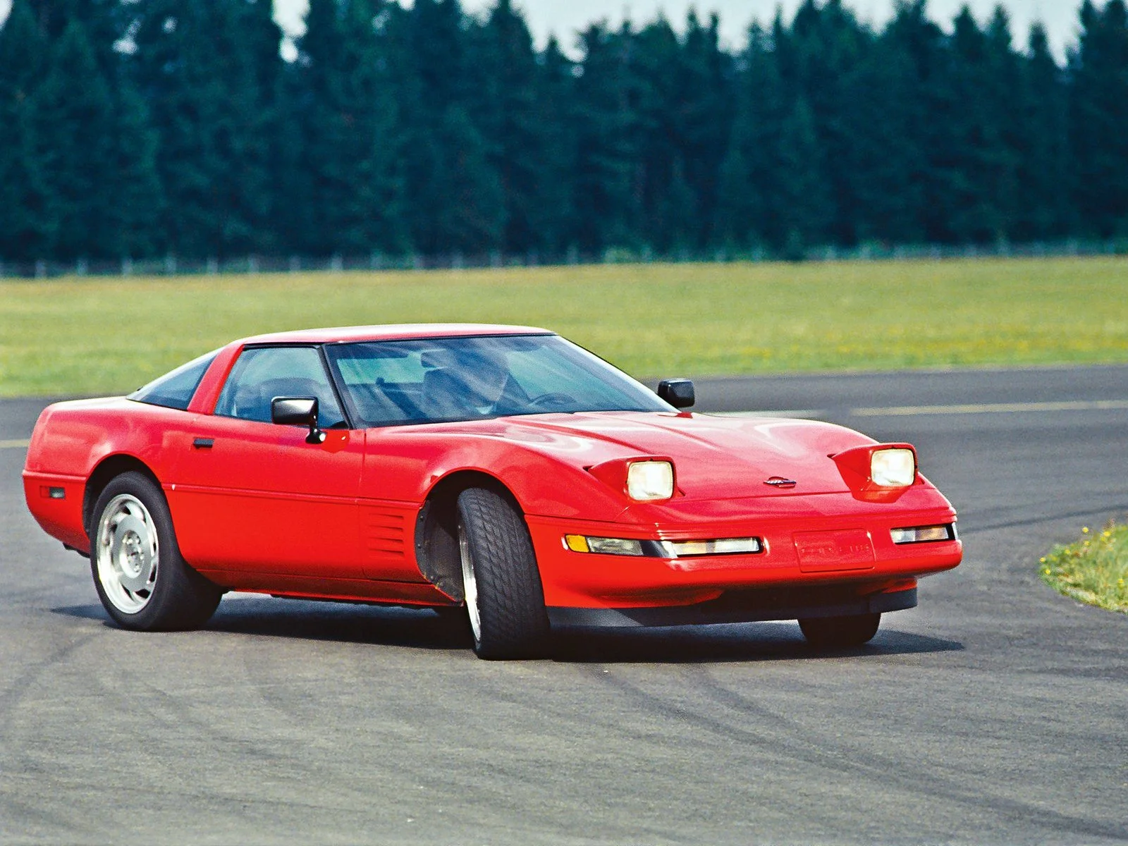 A 1991 Red ZR-1 being driven the way it supposed to be driven, sideways. 