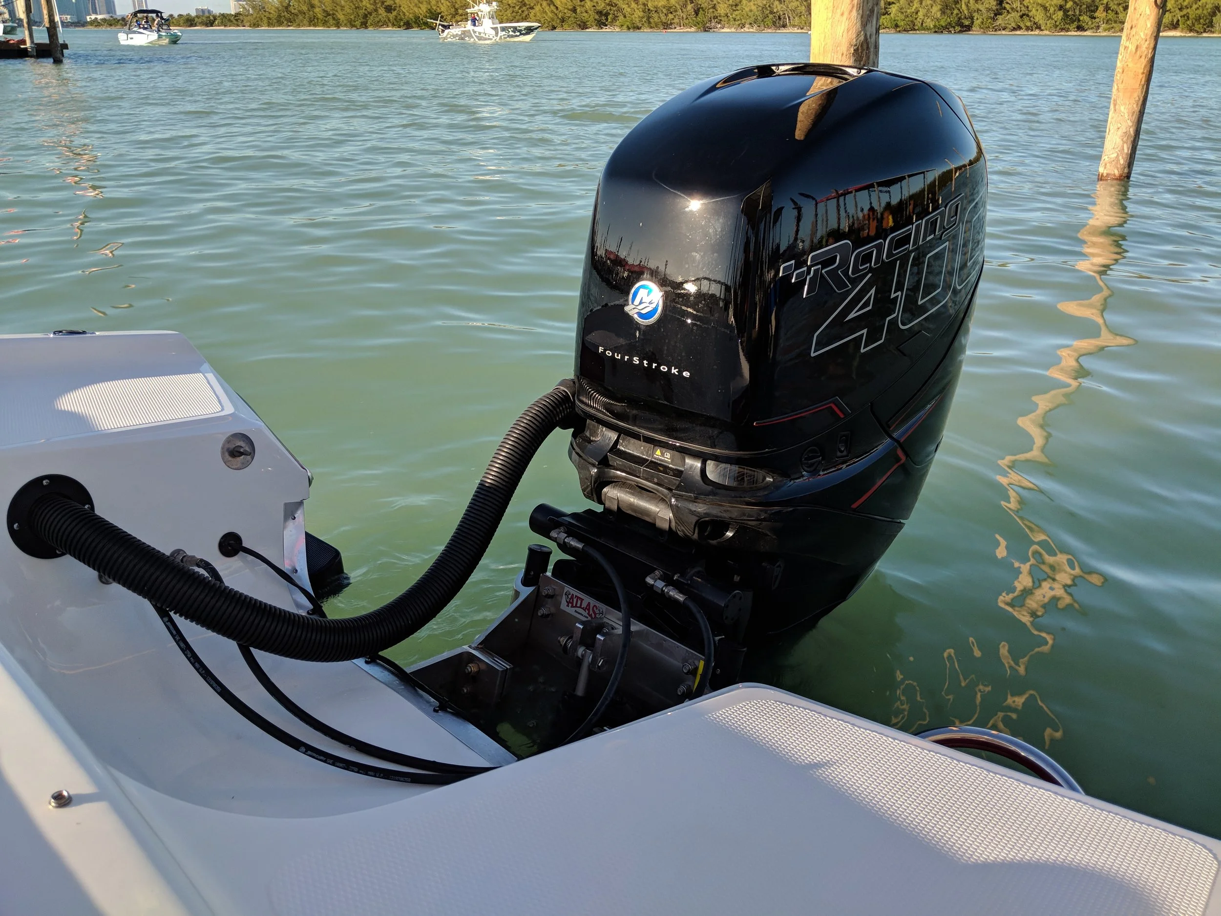 Notice the steering, clean rigging and integrated unit are an improvement over remote rams. Not quite as slick as the latest integrated systems from Evinrude or Yamaha, but nice. 