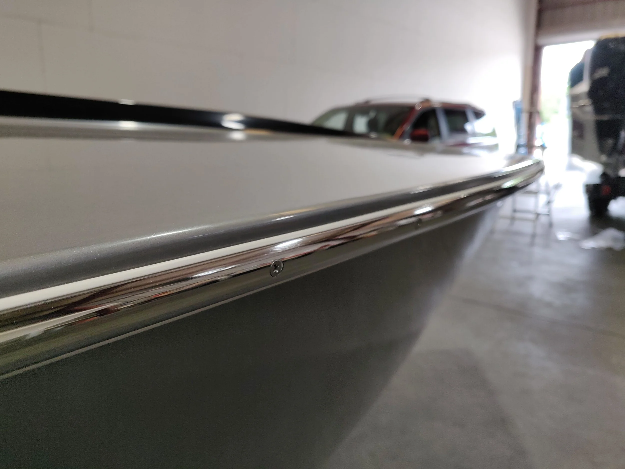 The rubrail is simple and clean. The vinyl backing protects the paint nicely.