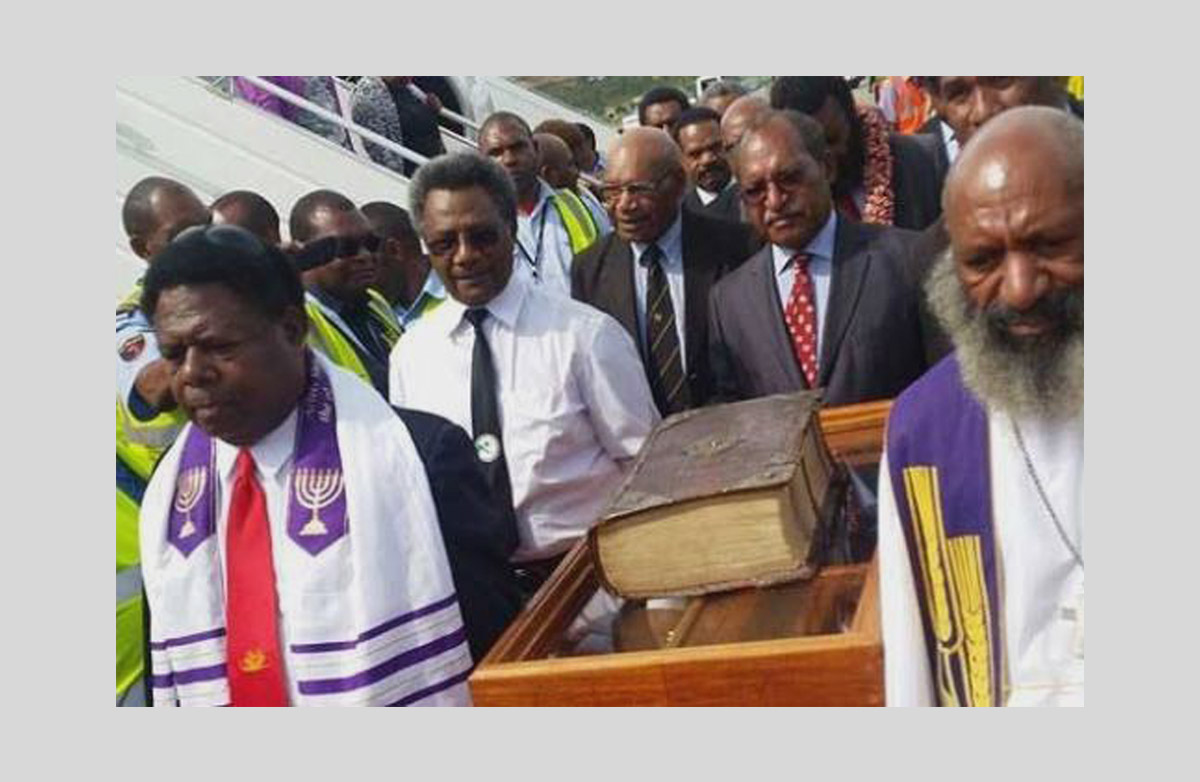 church leaders welcome a 1611 Bible at Jackson airport