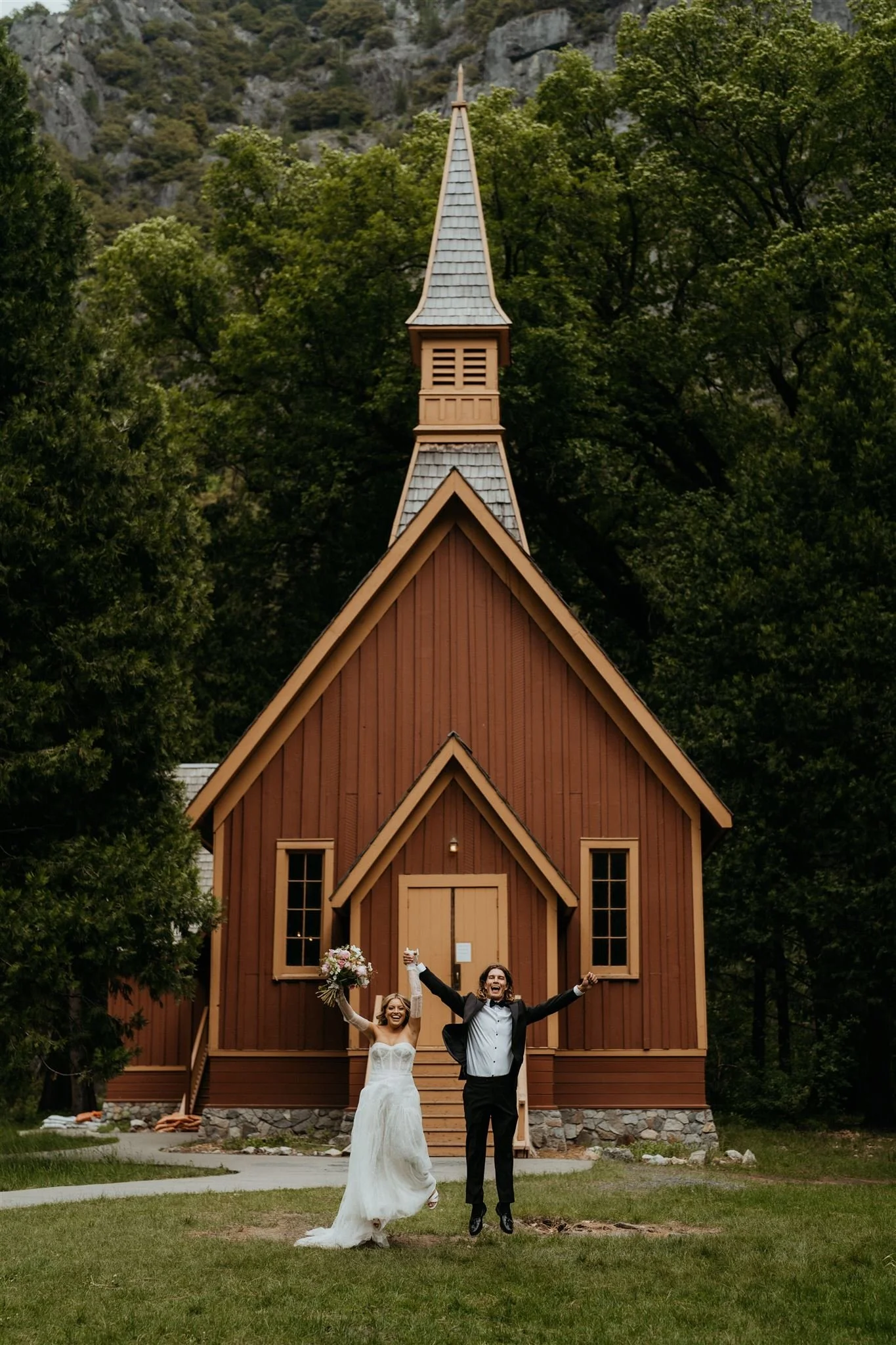 Bride and groom jump and cheer after their Yosemite chapel elopement