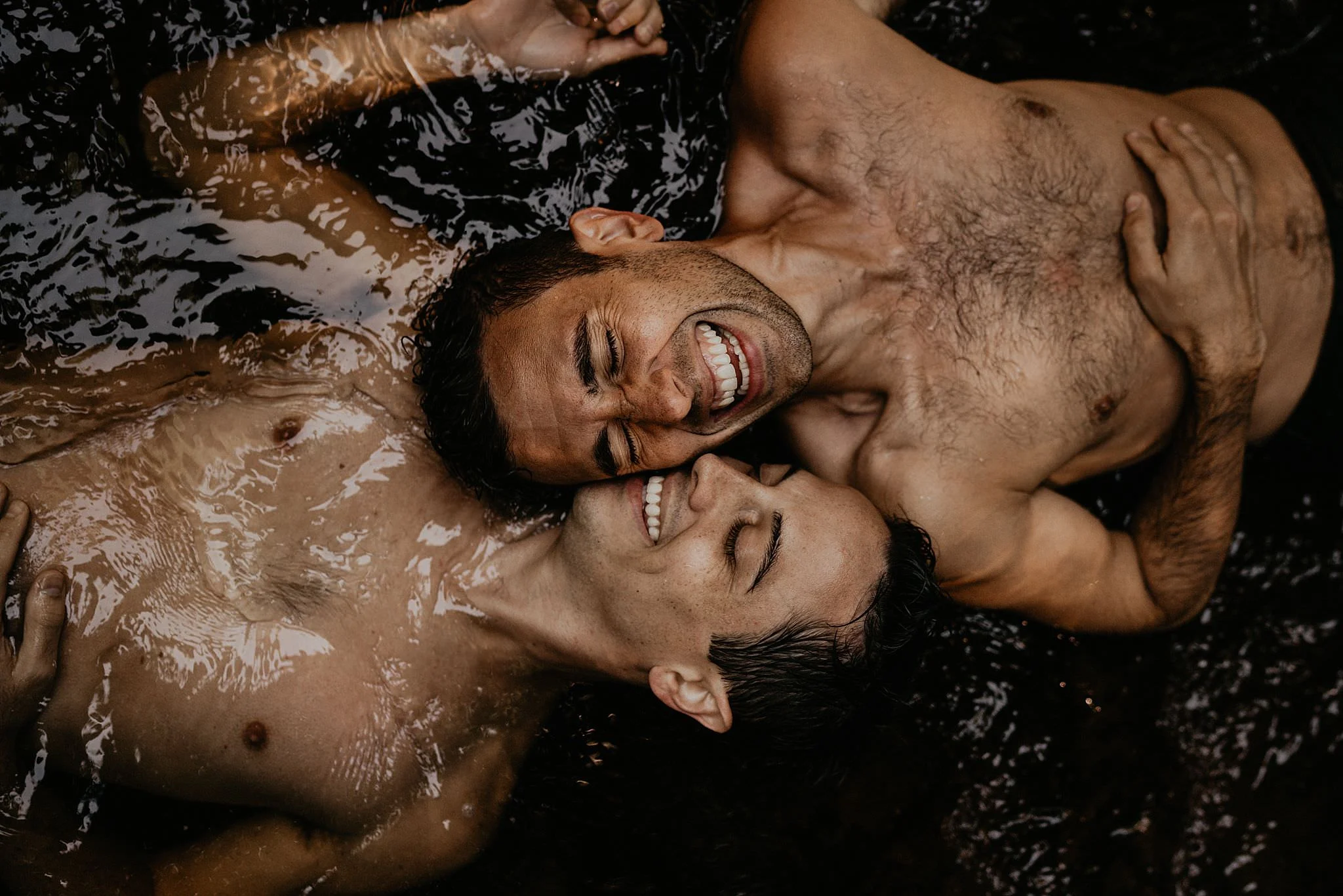 Same sex adventure engagement photo in lake in the Pacific Northwest Portland Oregon