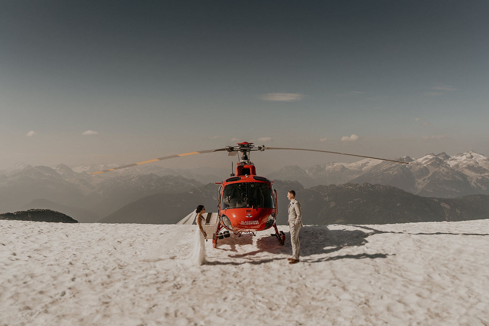 Jinza bridal wedding dress on top of whistler mountain in the snow for elopement