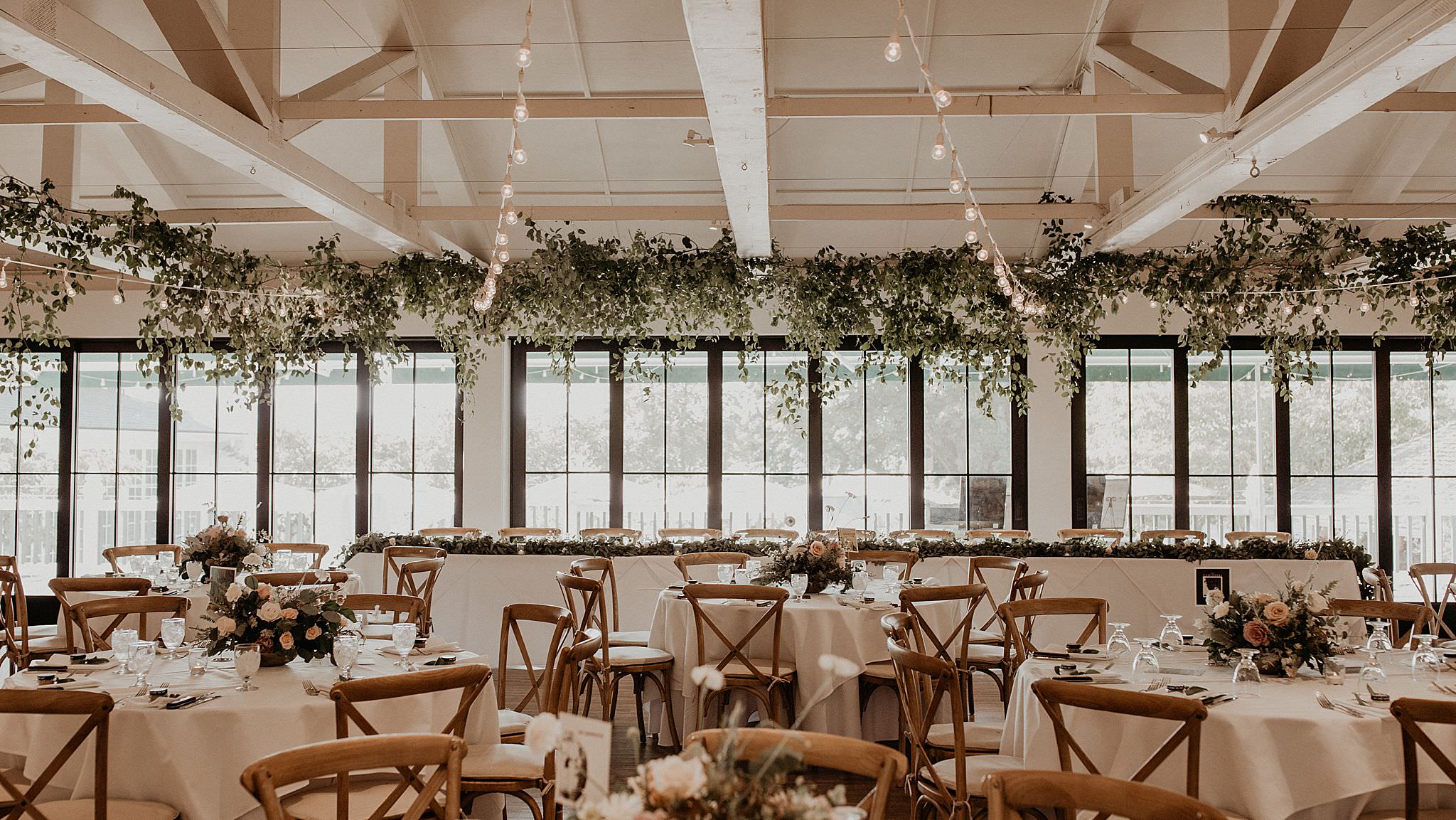 Beautiful greeneries and eucalyptus decoration wedding reception tables Roche Harbor wedding 