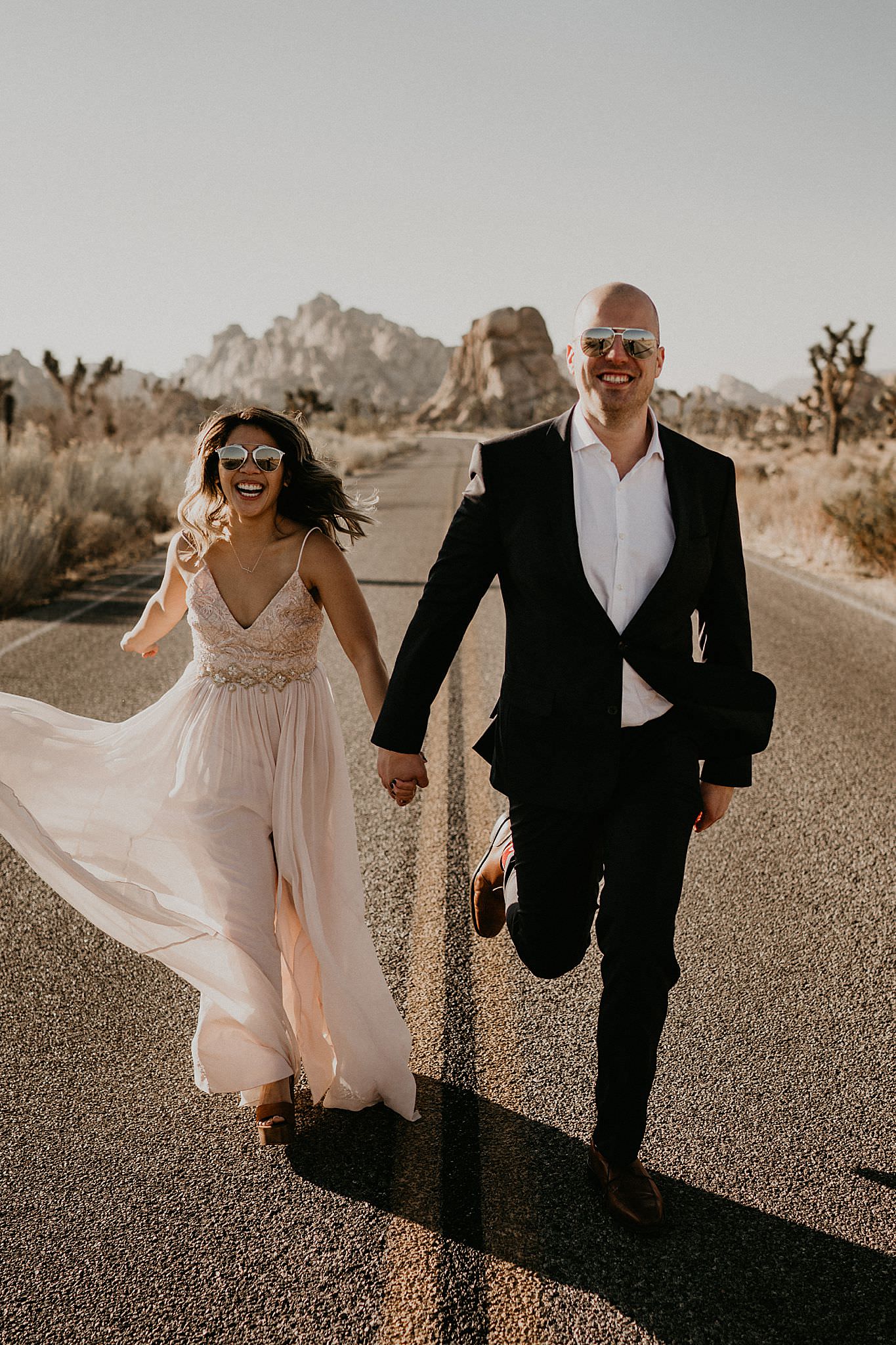 Couple running and adventuring around Joshua Tree national park