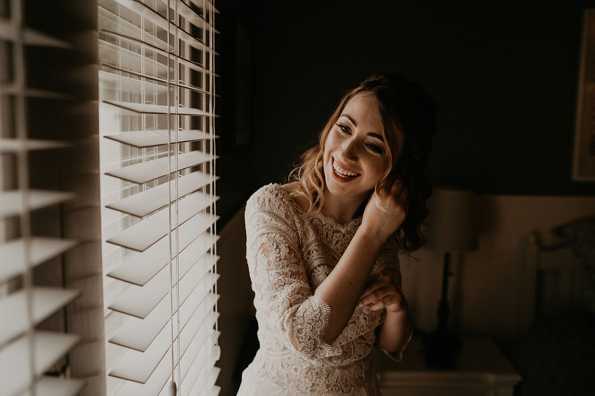 Bride getting ready in her boho wedding dress for her intimate wedding at Ebey's landing on Whidbey island