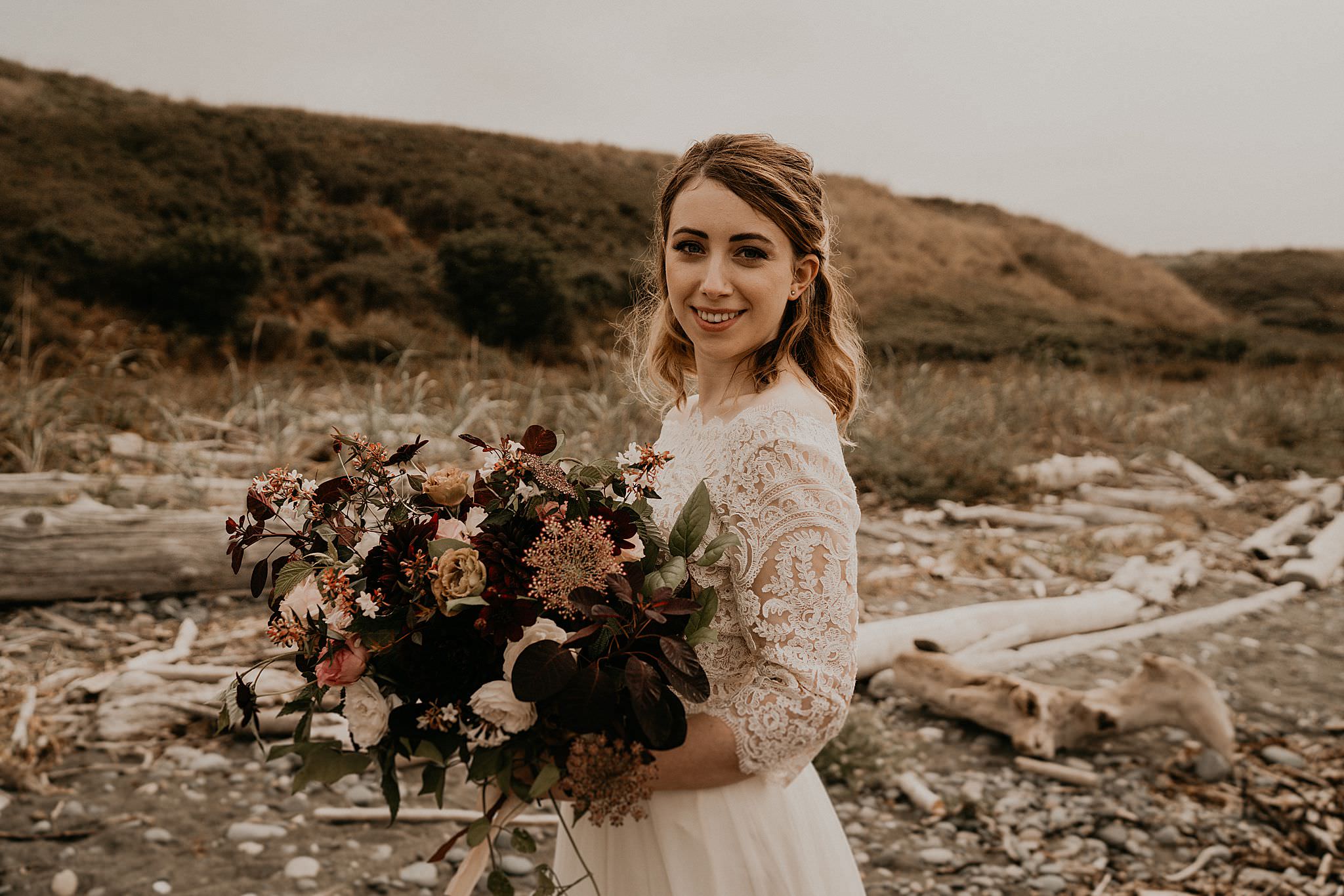 Bride and her beautiful bouquet on Whidbey Island at Ebey's landing